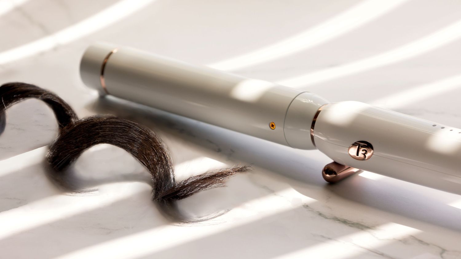 White electronic vape device casting shadows on light fabric background.
