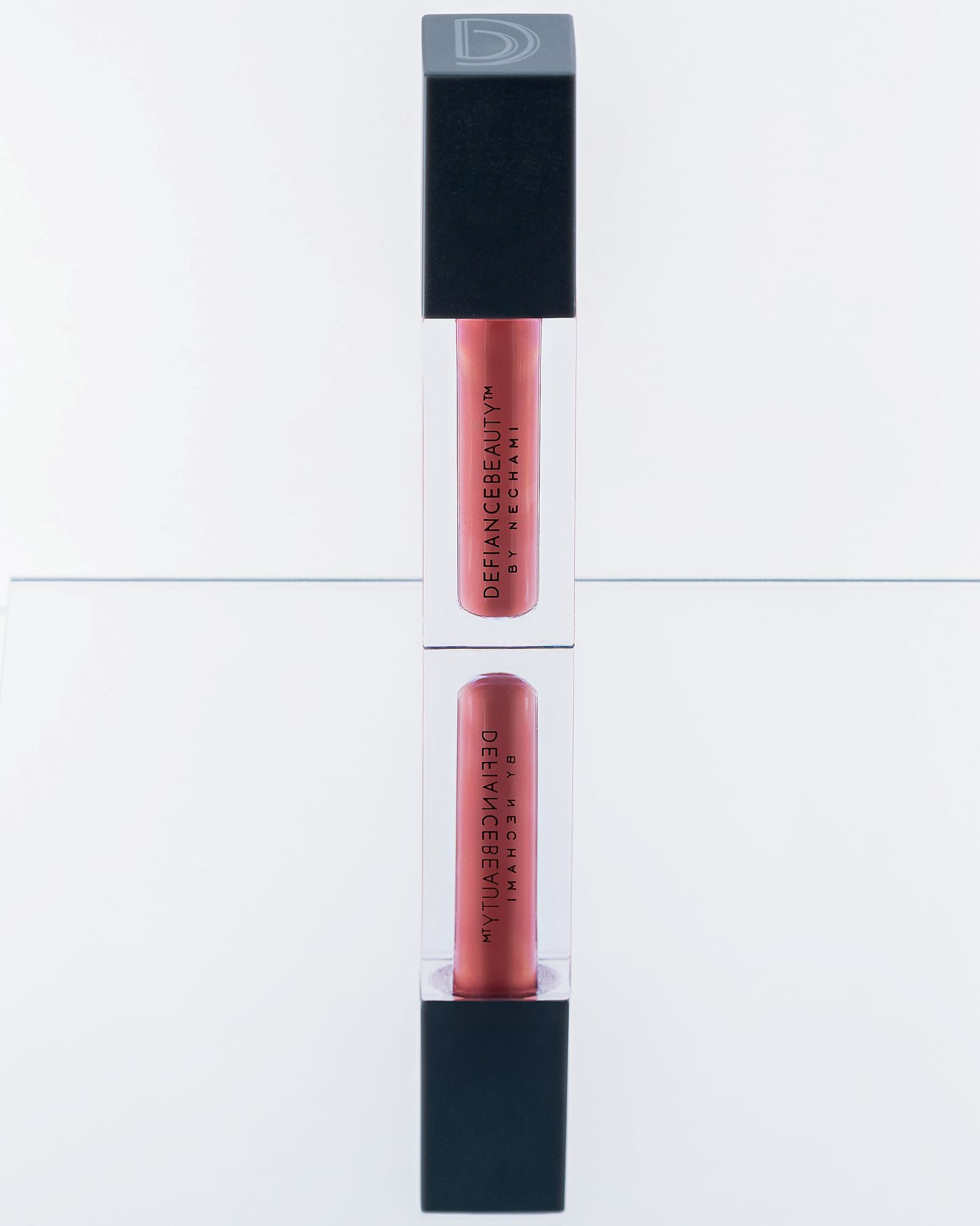 Two matte liquid lipsticks with black caps displayed on white background.