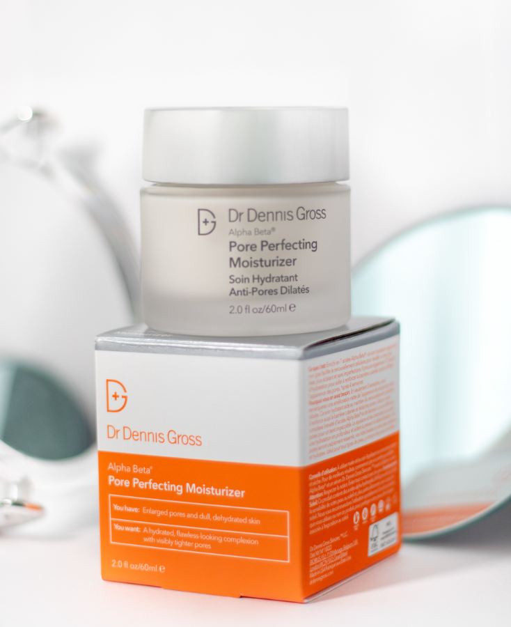 Dr. Dennis Gross Pore Perfecting Moisturizer skincare product with orange packaging box on light background.