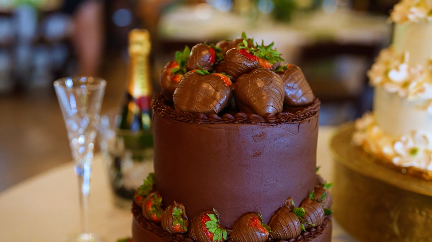 Close-up of gourmet chocolate desserts and treats arranged at a wedding reception.