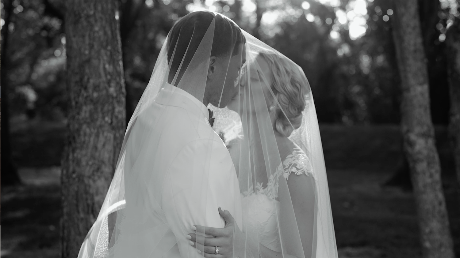 Black and white photo series of a couple walking and dancing in a scenic outdoor setting.