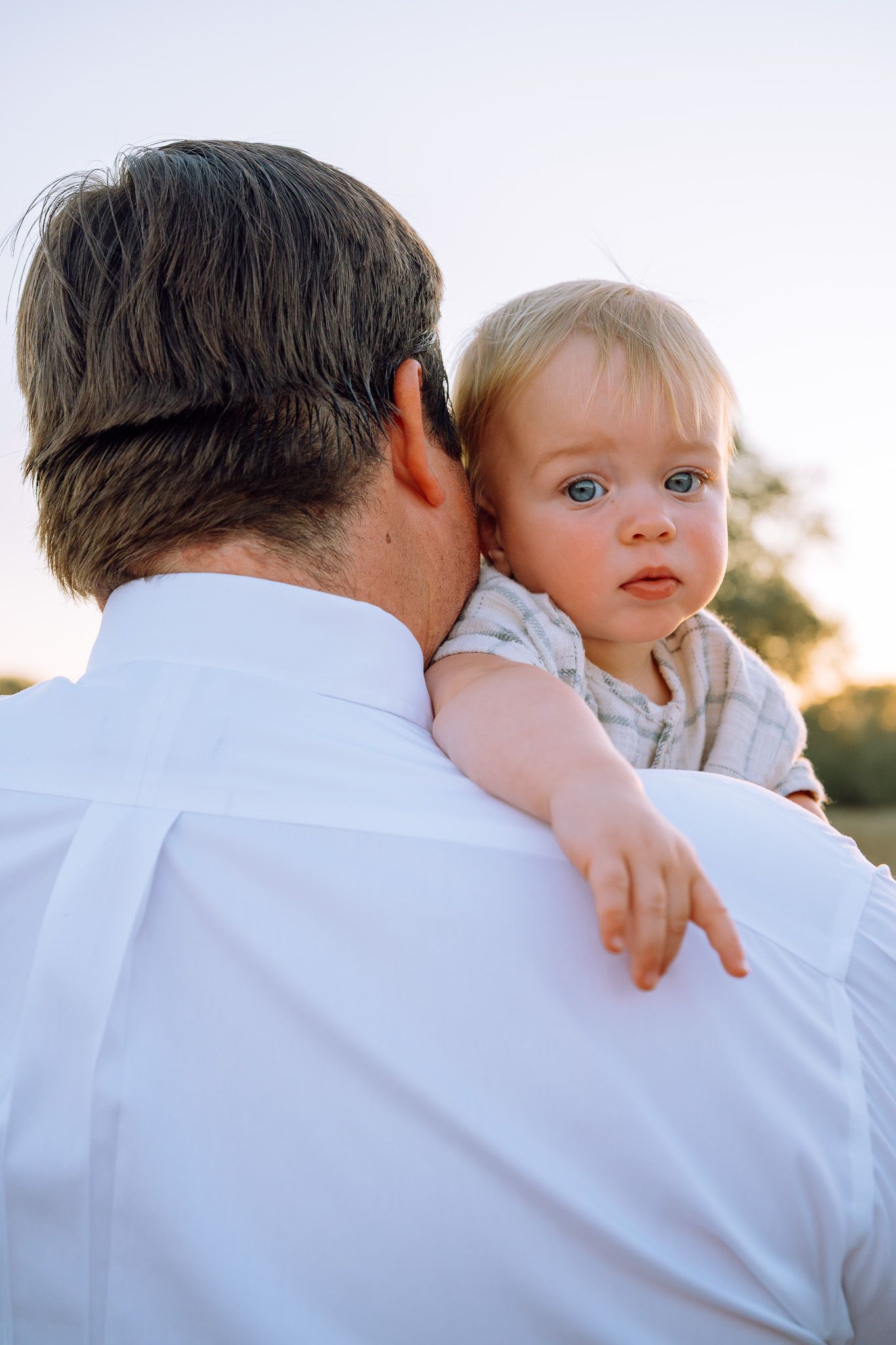 Outdoor portrait sequence showing an intimate moment at sunset.