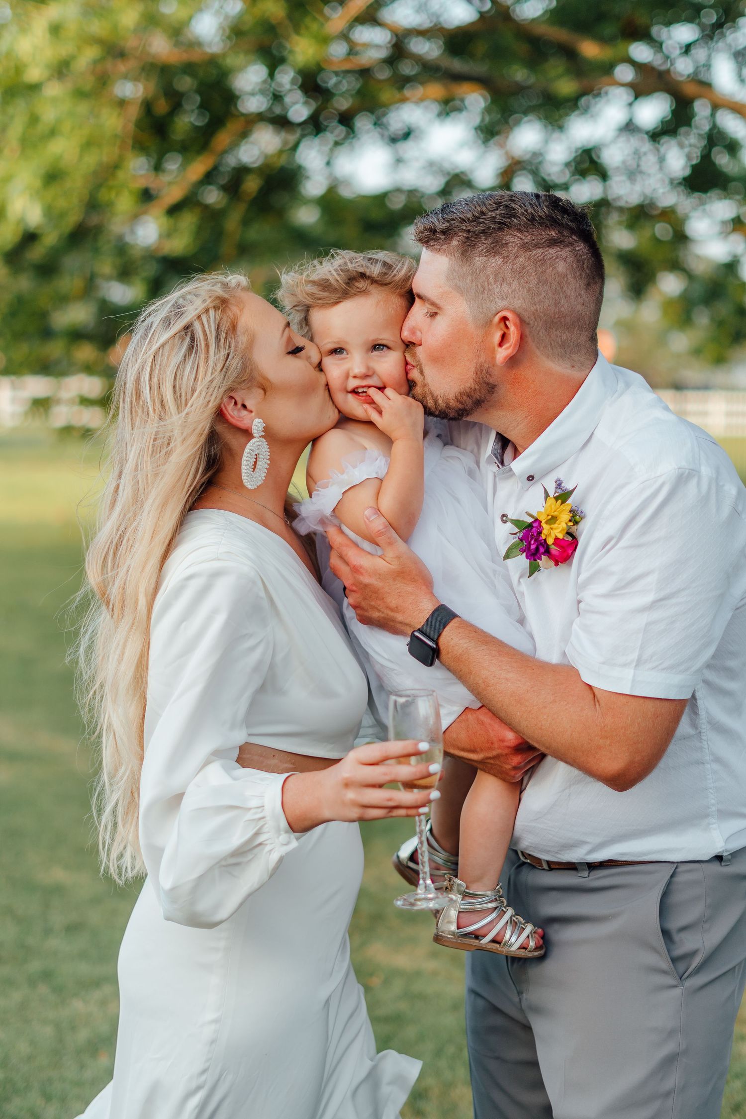 Family photoshoot sequence outdoors with siblings sharing affectionate moments in white and gray outfits.
