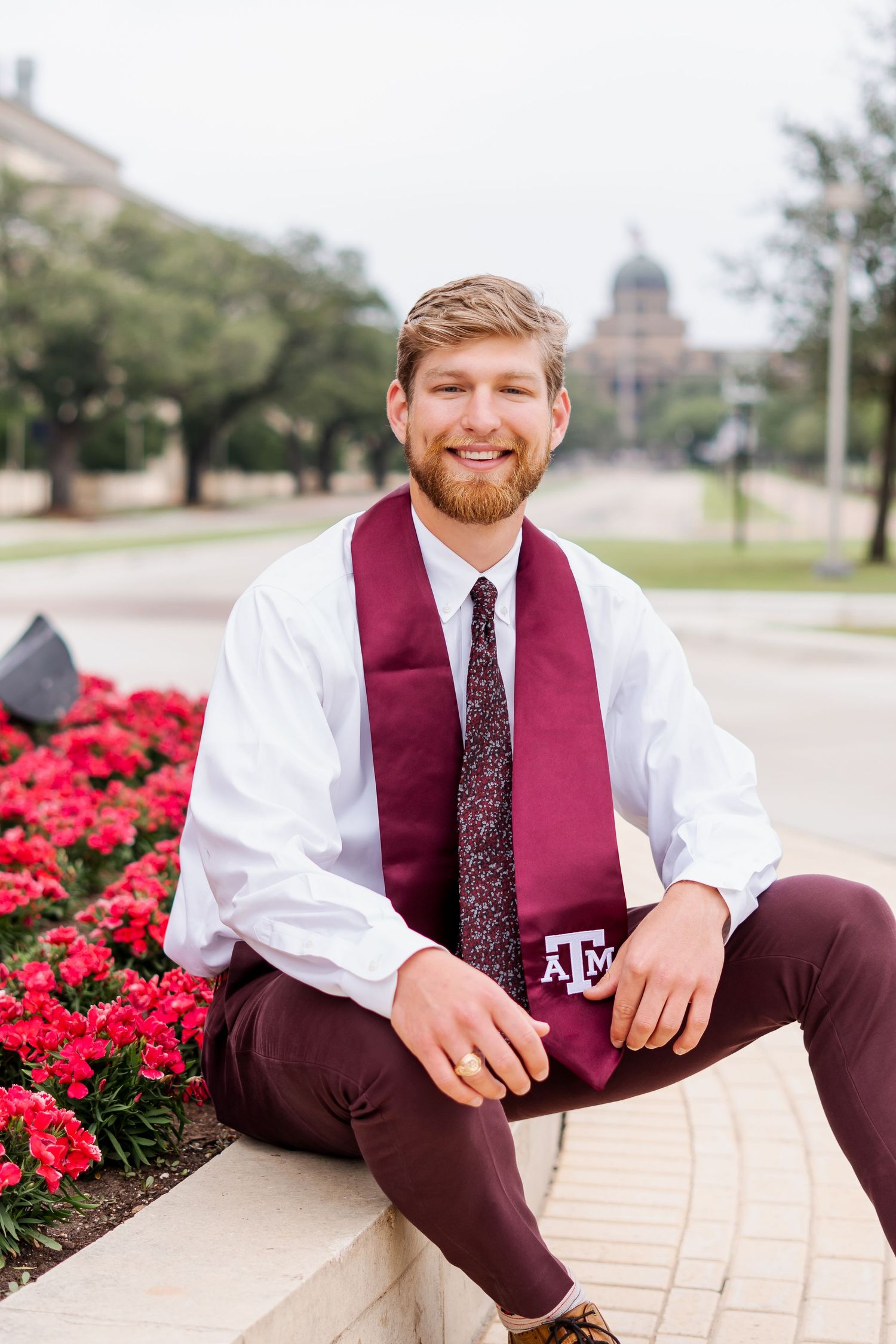 Graduation photos showing graduate in maroon and white attire with university branding.