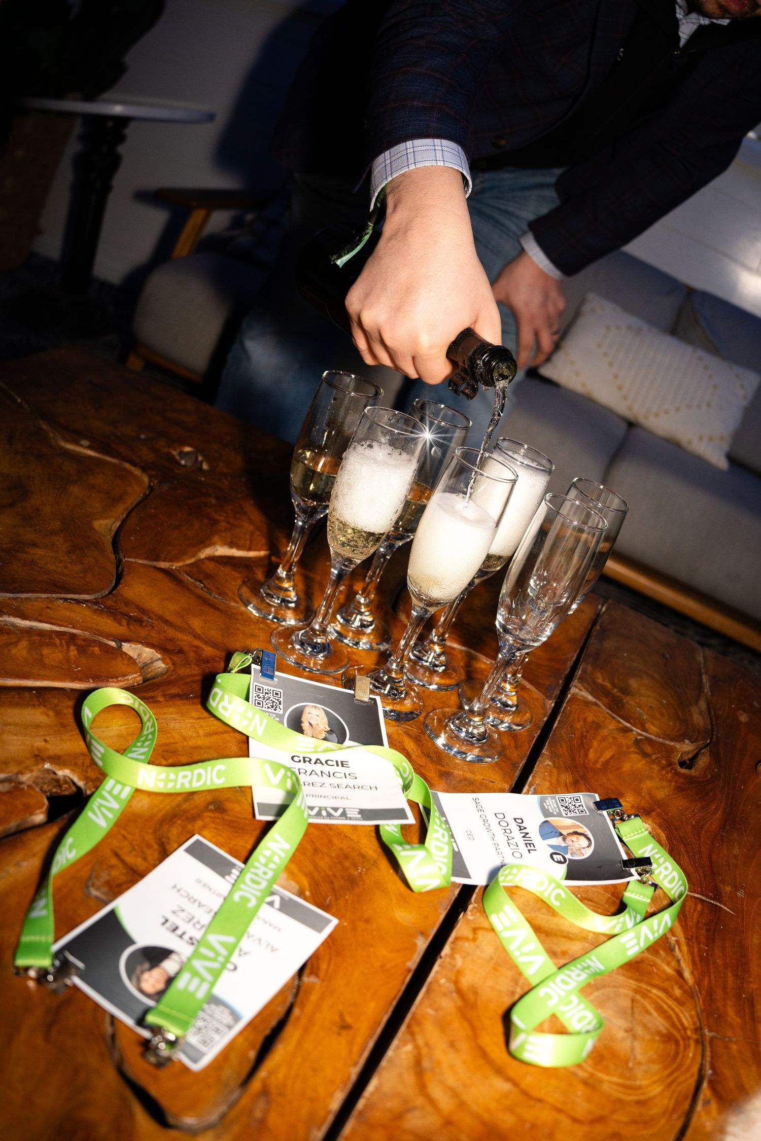 A sequence of shots showing green Xbox game pass cards arranged with beer glasses on a wooden table surface.