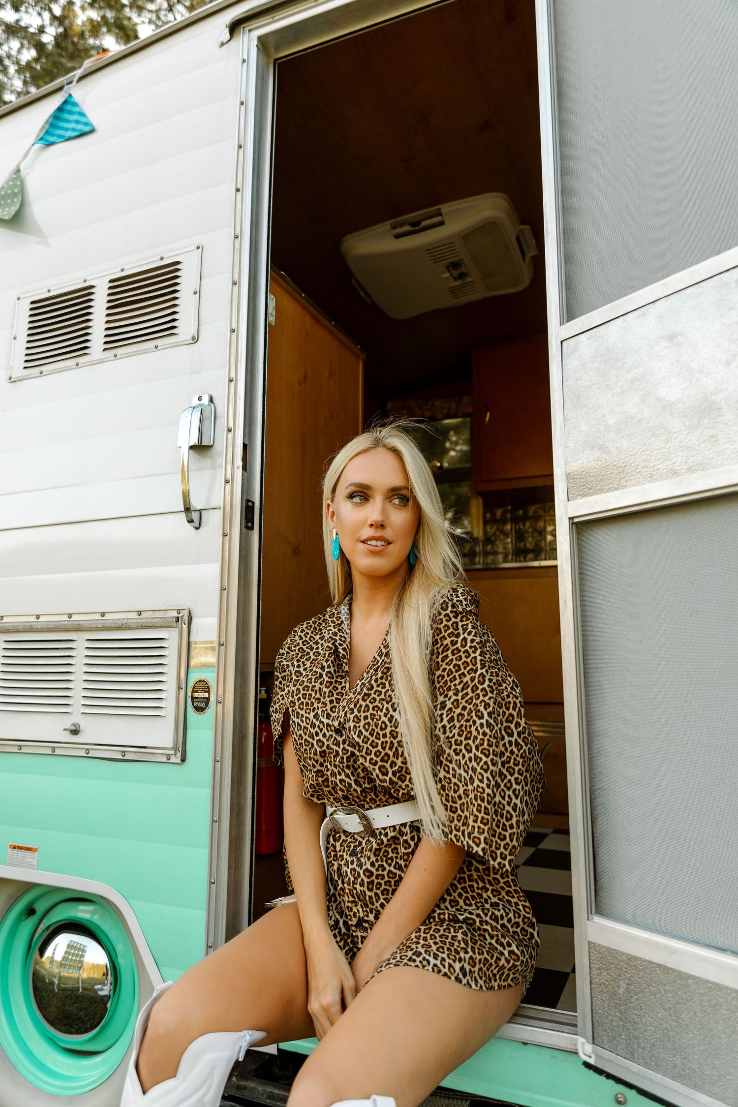 Retro camper photoshoot featuring leopard print outfit and mint green accents. Nashville artist/country music singer tracie lynn