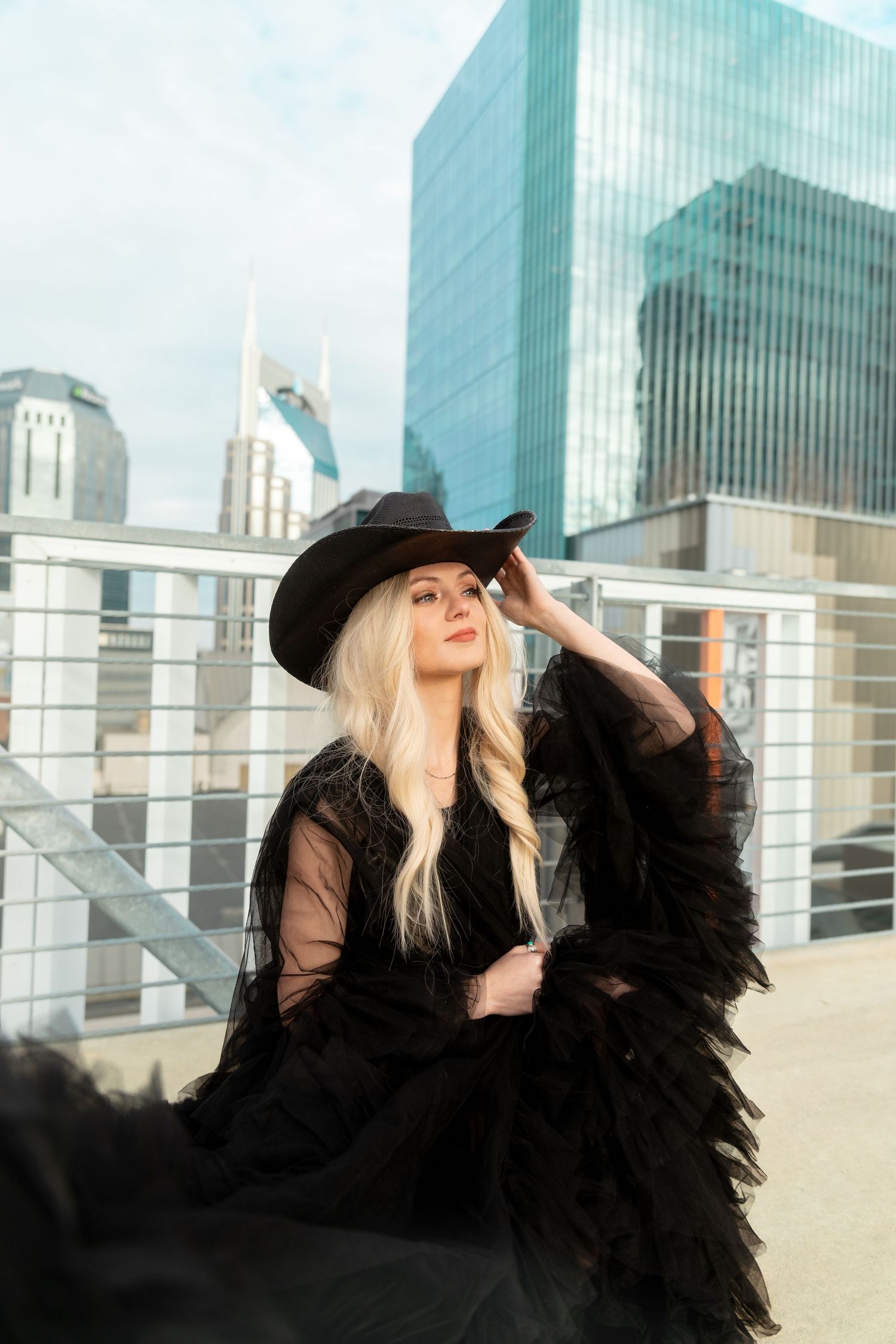 Dramatic fashion portrait on a rooftop in downtown nashville.