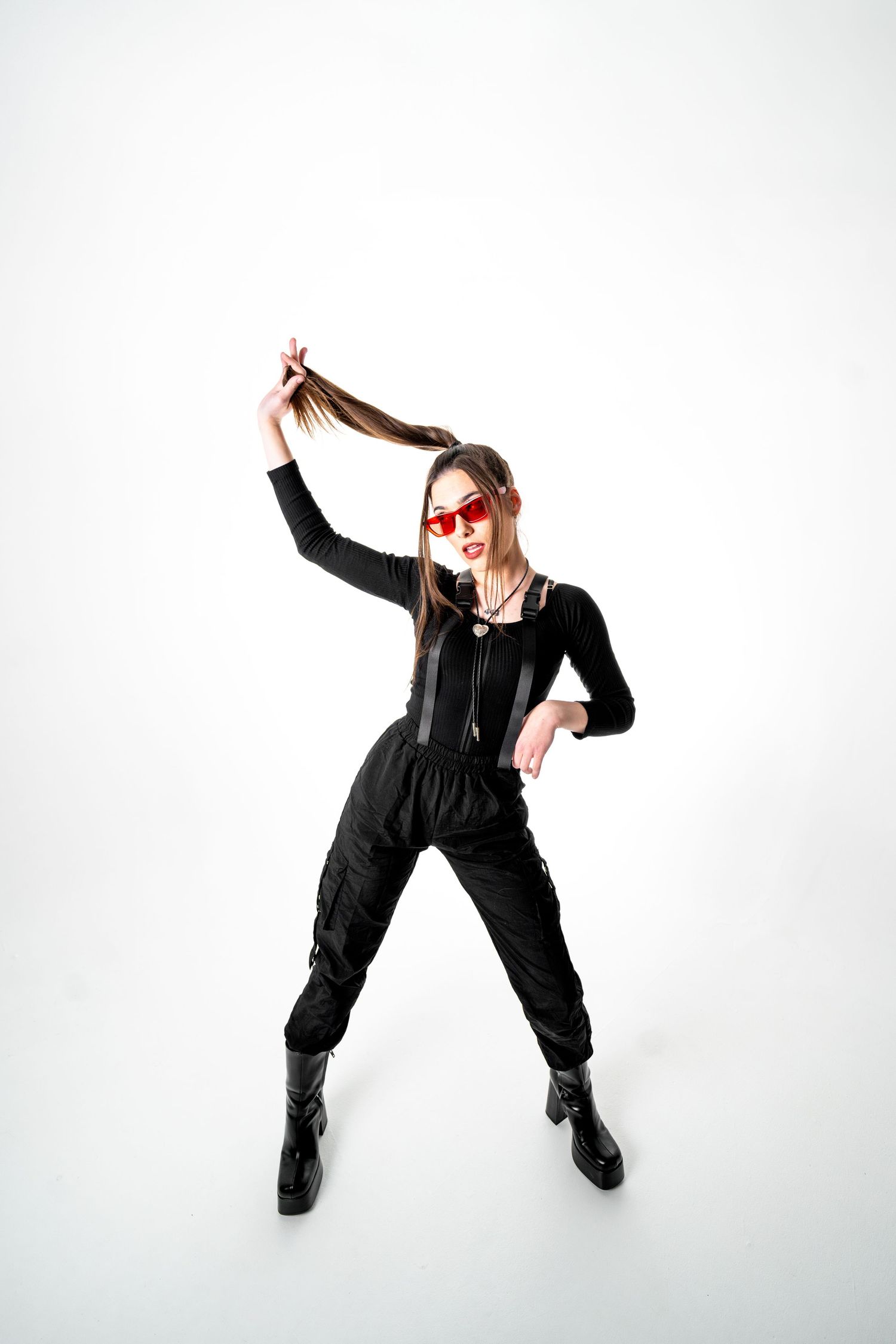 Artistic black and white photo series showing dynamic dance movements in dark clothing of nashville EDM artist, SQUUID (Sydney Clancy)