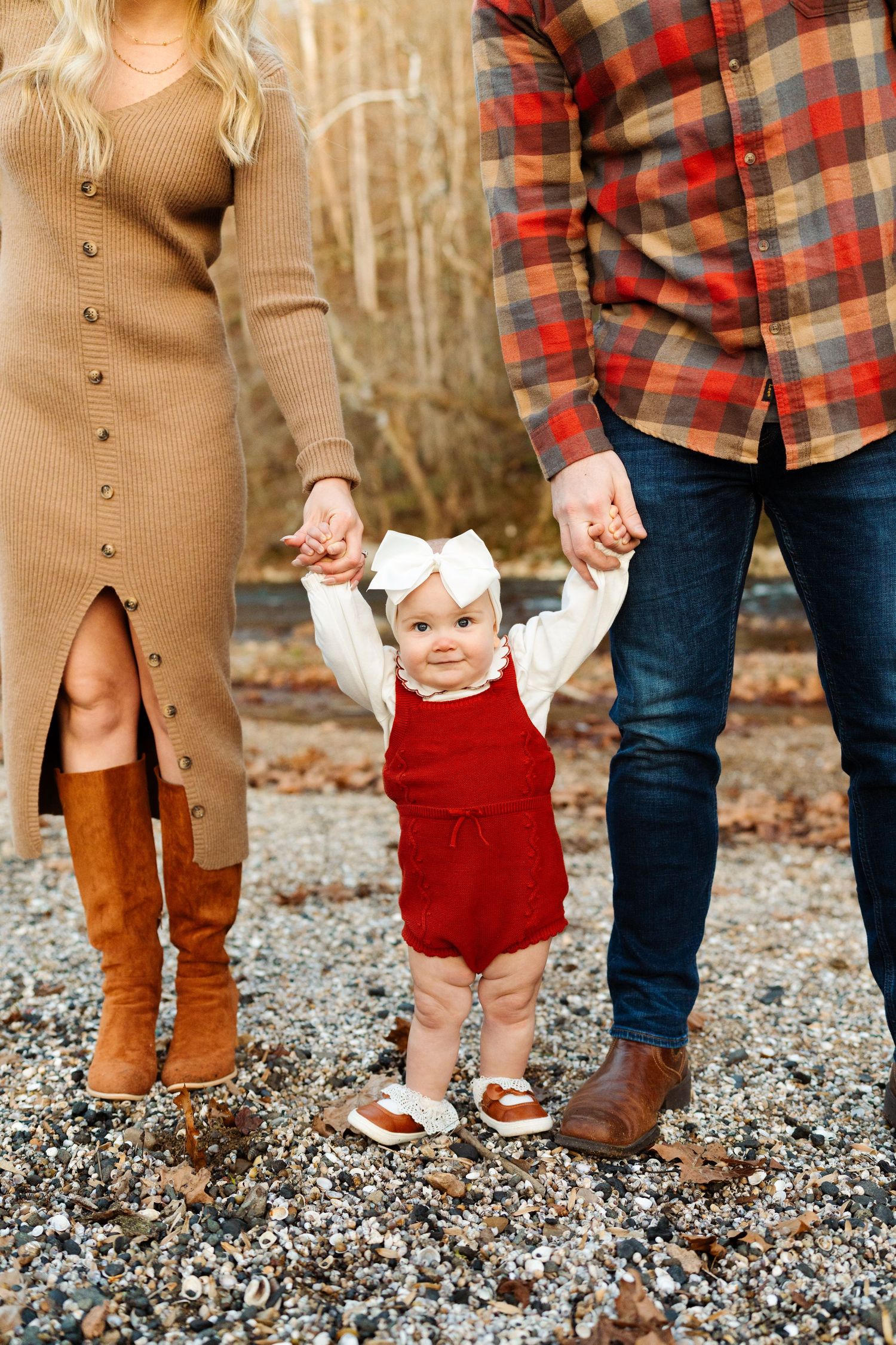 Family photo showing coordinated fall outfits on gravel path.