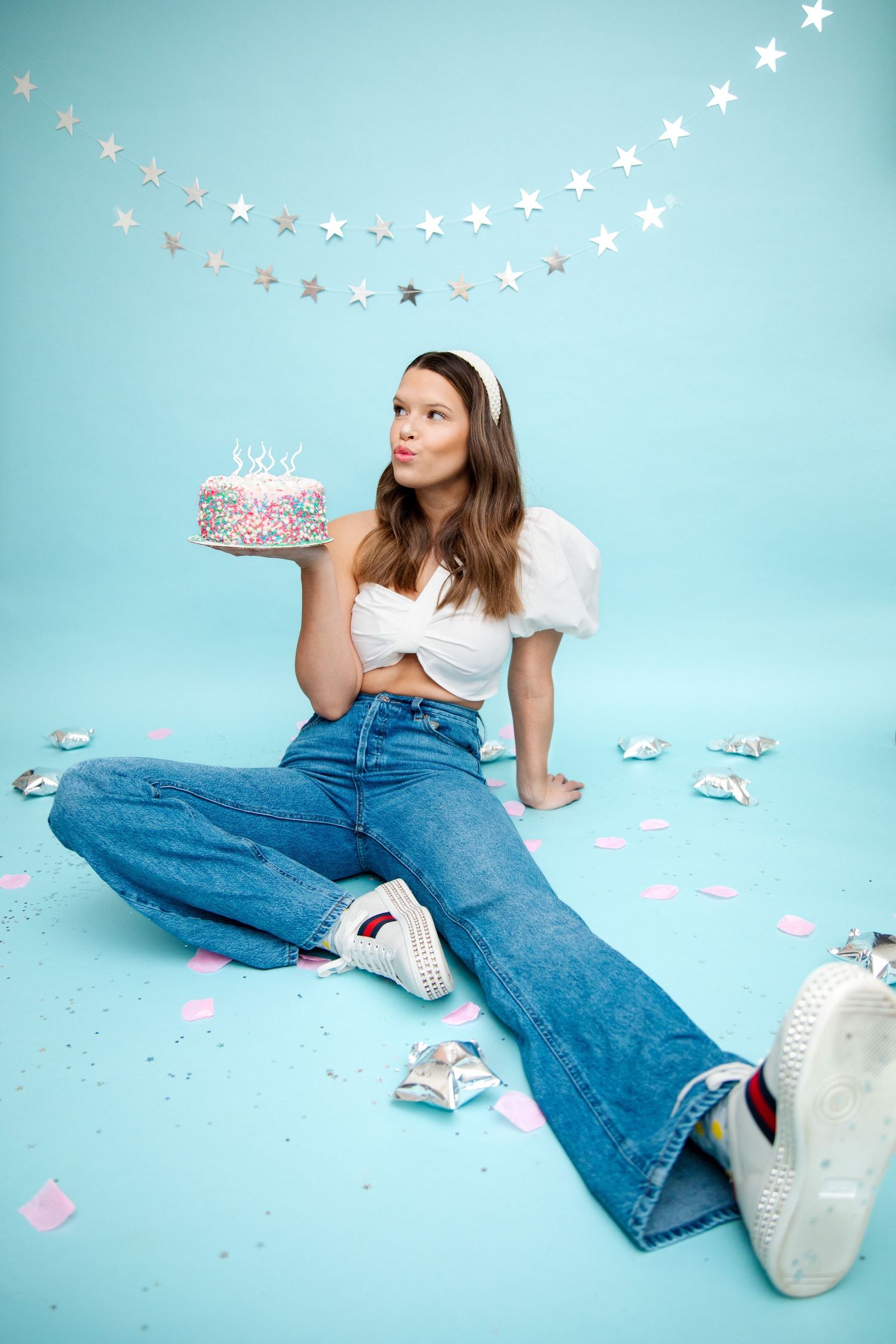 Whimsical photo session with star decorations and casual denim style. Birthday photoshoot in nashville