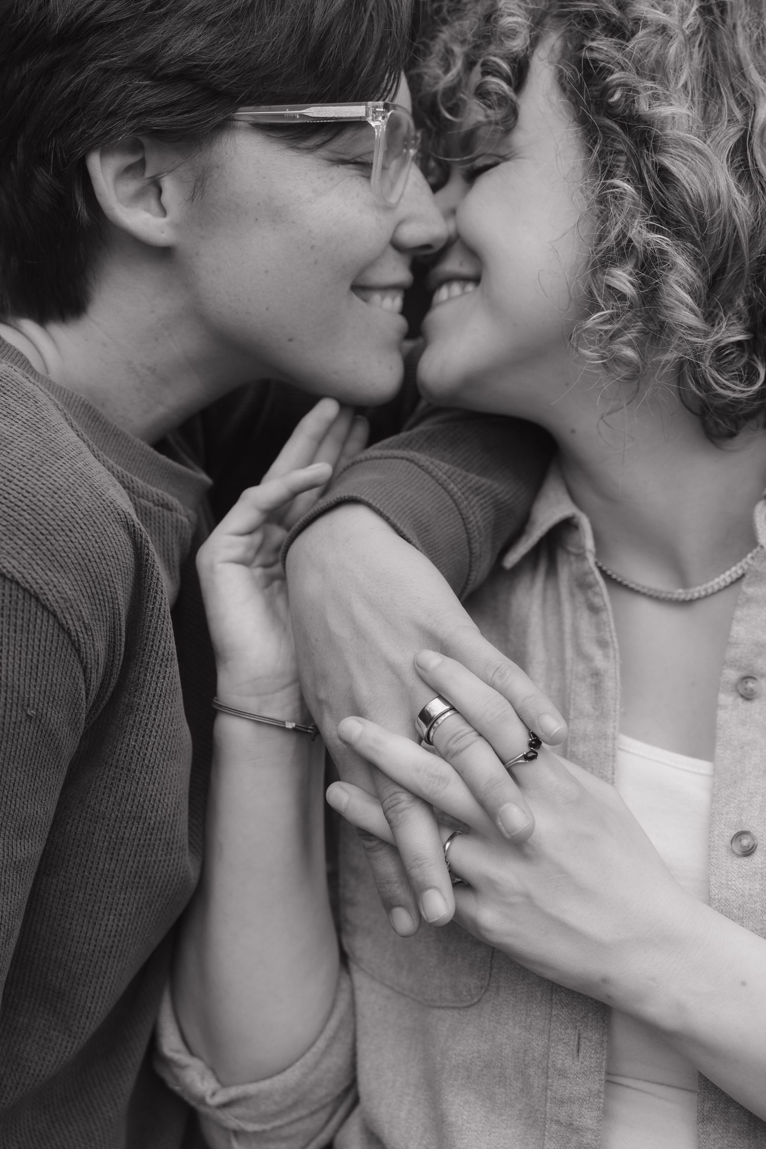 A romantic black and white photo sequence showing a couple sharing tender kisses and intimate moments.