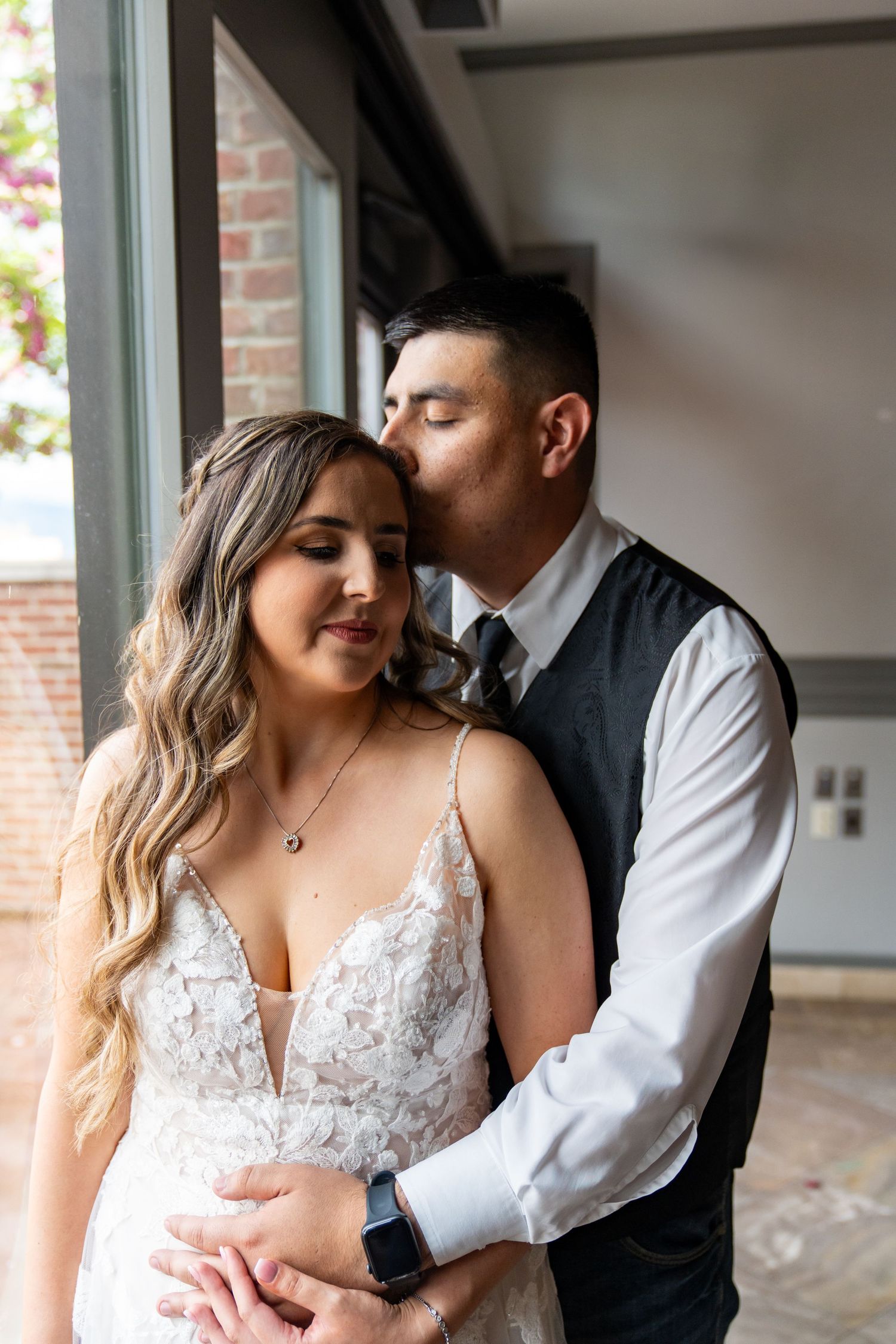 Intimate wedding couple portraits showing tender moments in natural light.