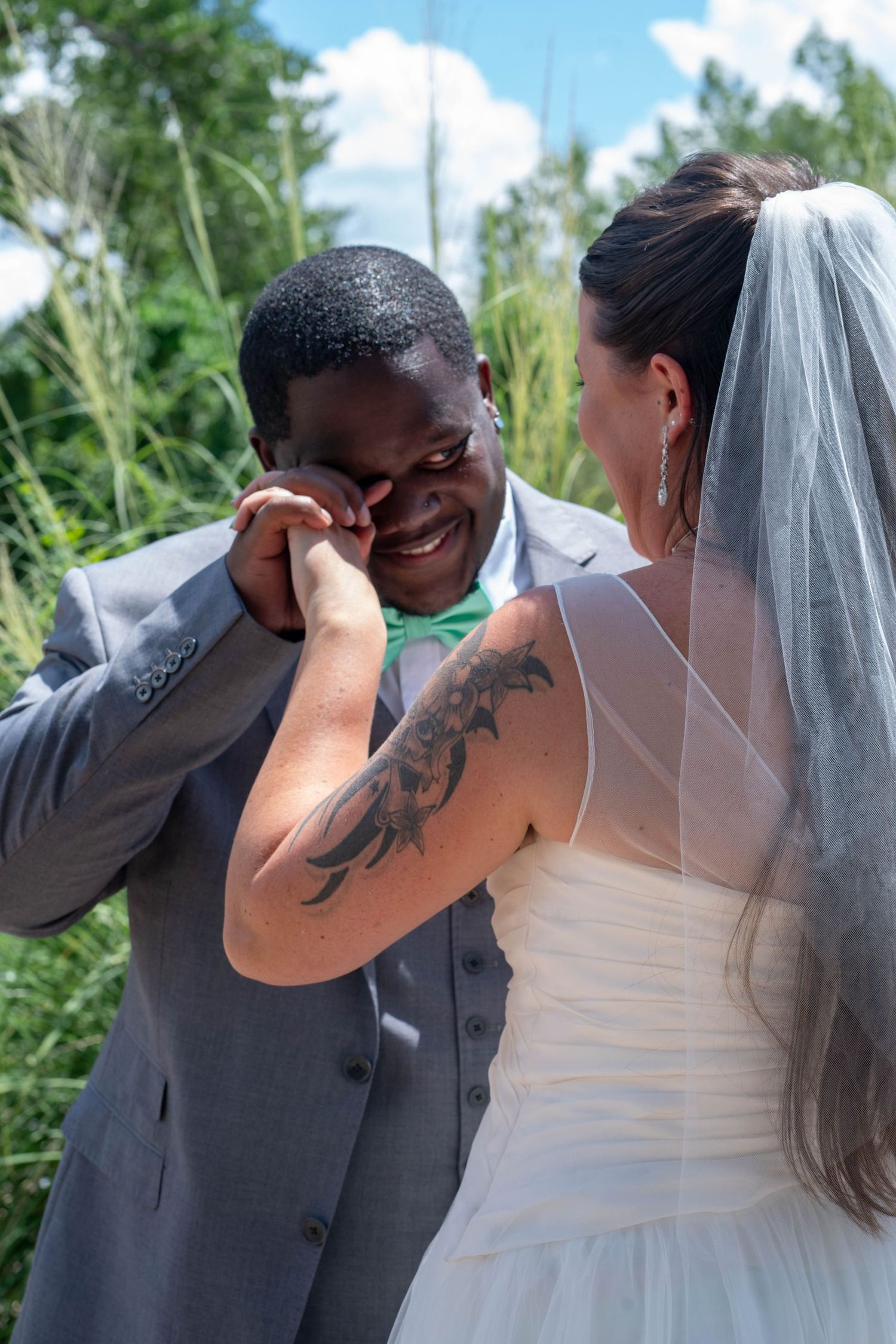 A sequence of emotional reactions during a wedding ceremony captured in multiple frames outdoors.