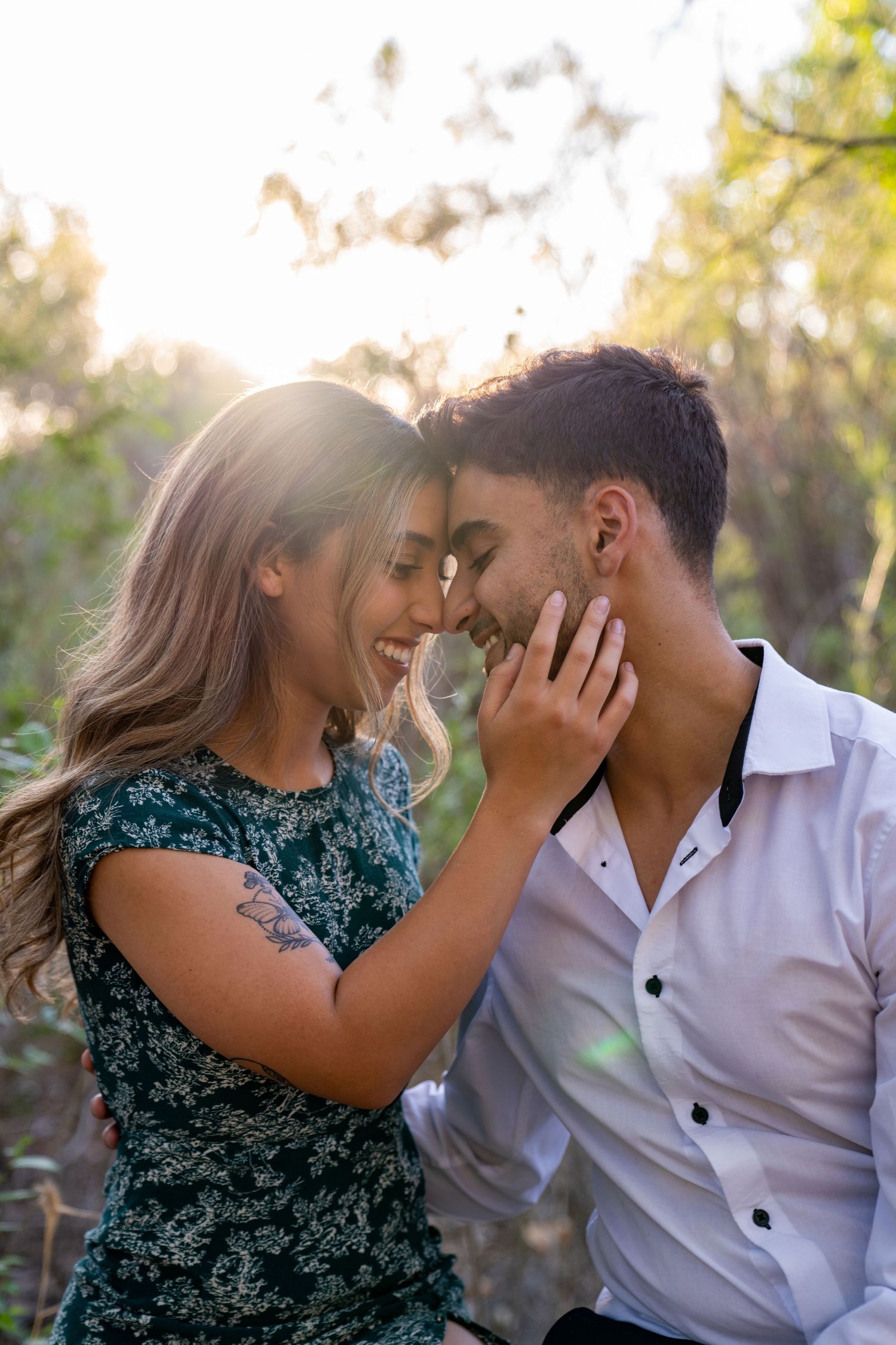 A couple shares intimate moments outdoors in a series of candid photographs with natural lighting and greenery.