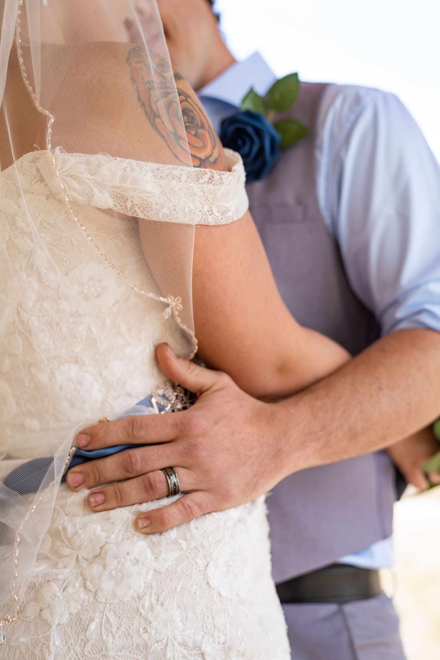 Close-up shots of a couple's hands and torso during an intimate wedding dance moment.