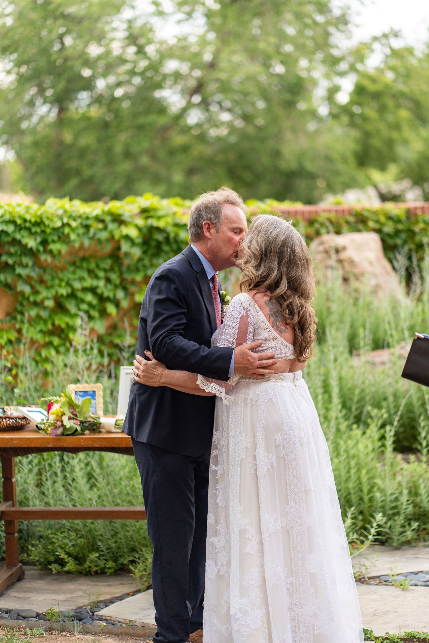 Intimate wedding ceremony moments shared in a lush garden setting.