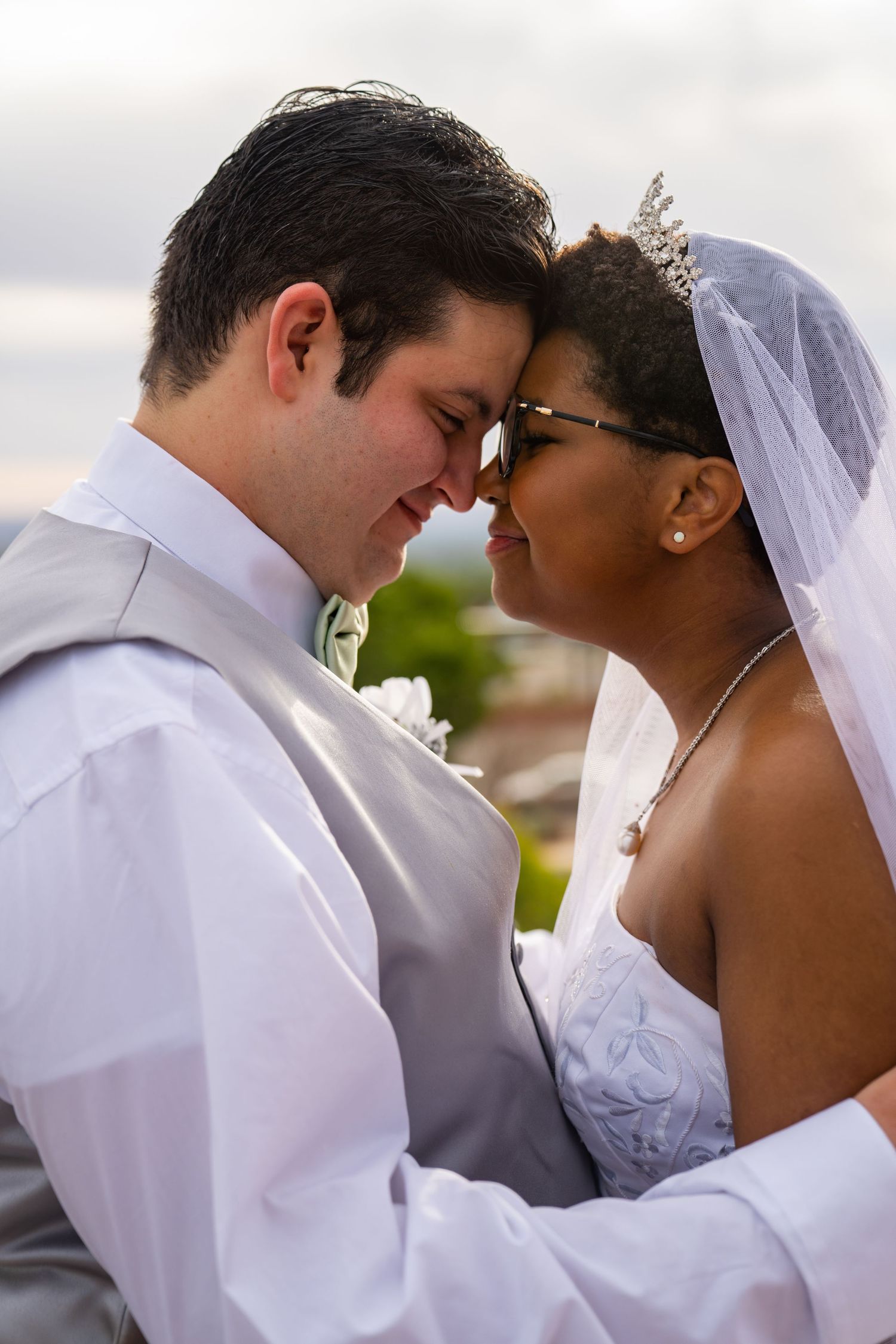 A romantic wedding couple shares intimate moments in a series of tender close-up portraits.