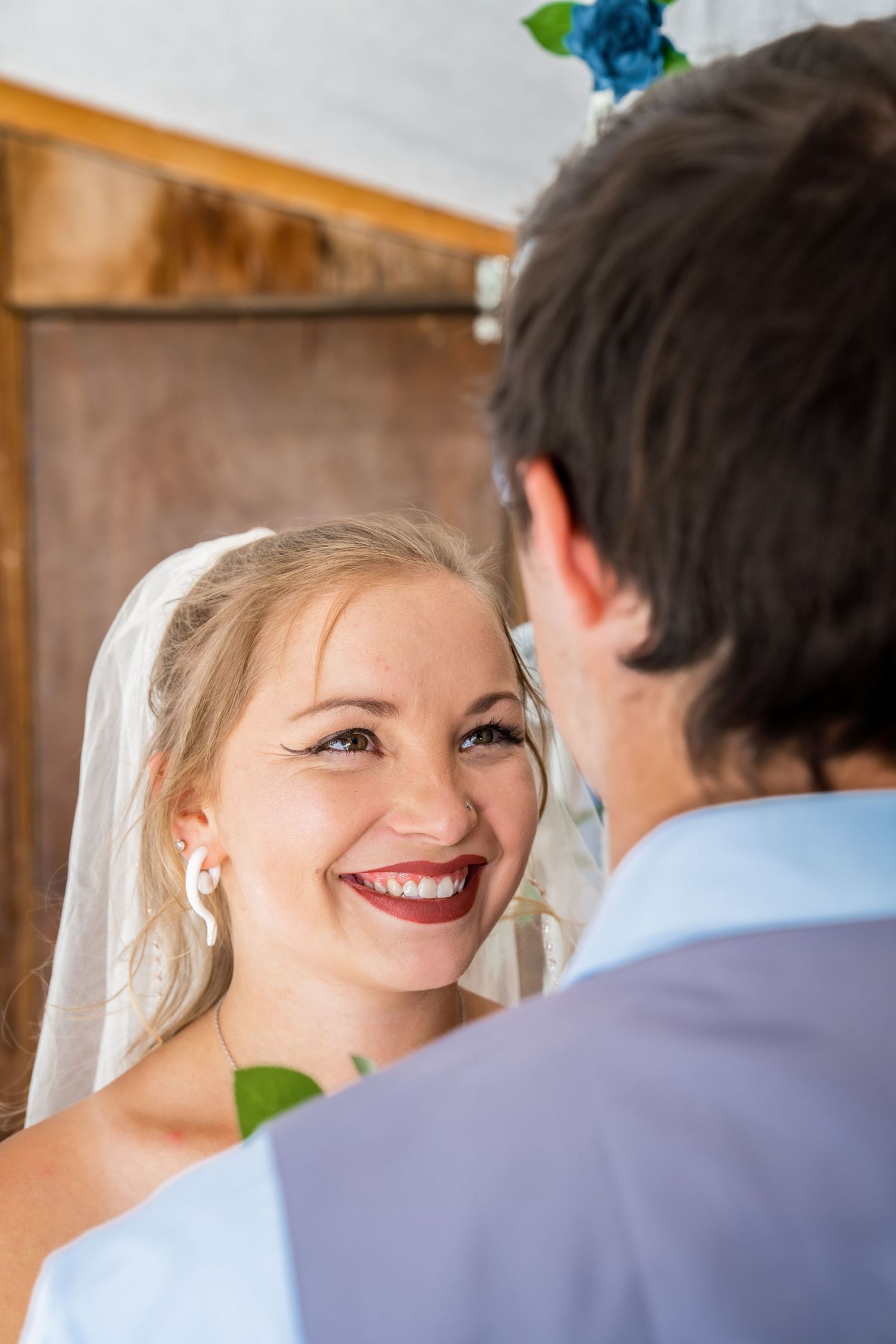 A close-up sequence shows tender moments between newlyweds during their first look on their wedding day.