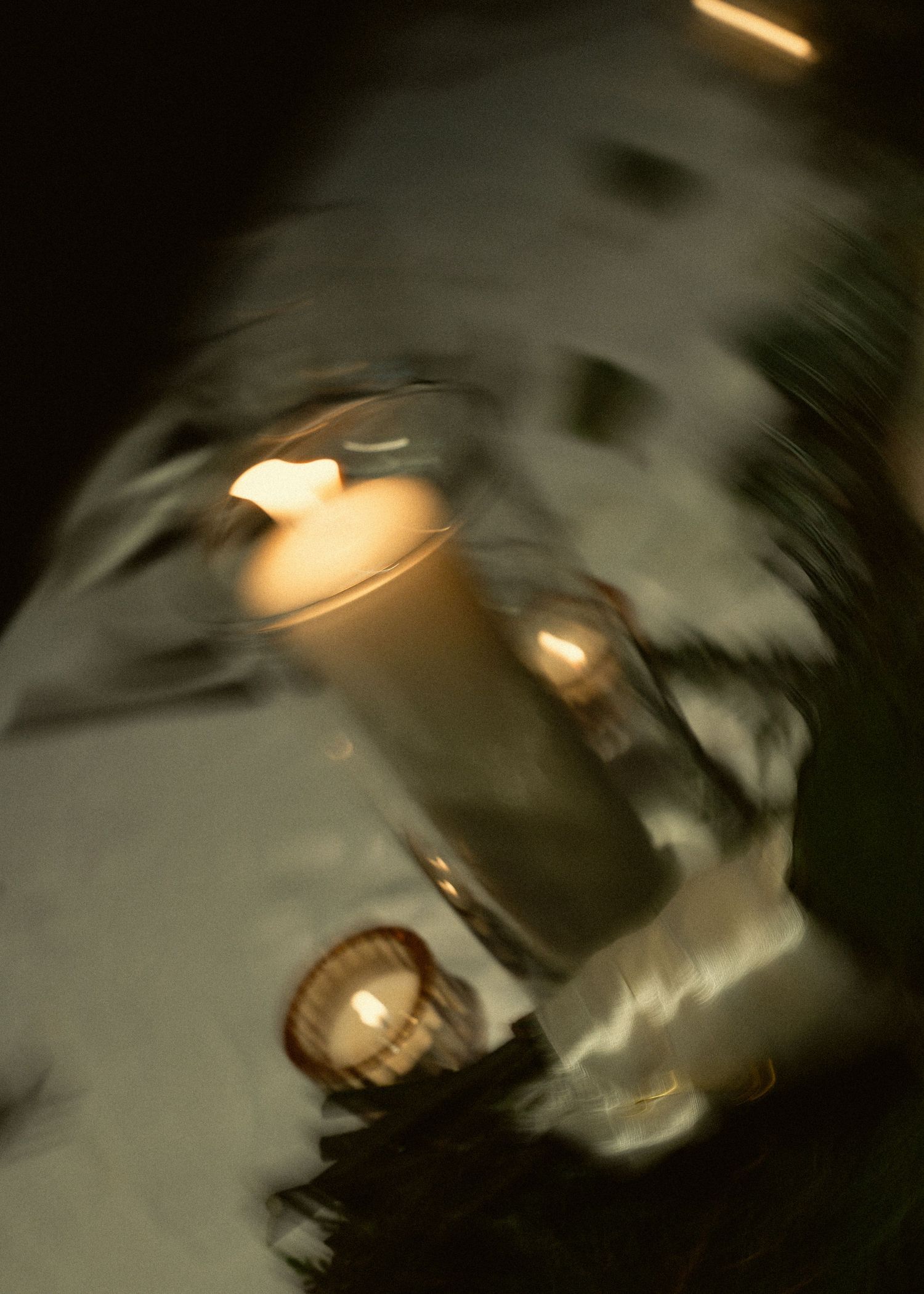 Abstract black and white photograph showing blurred light streaks and shadows creating an ethereal motion effect.
