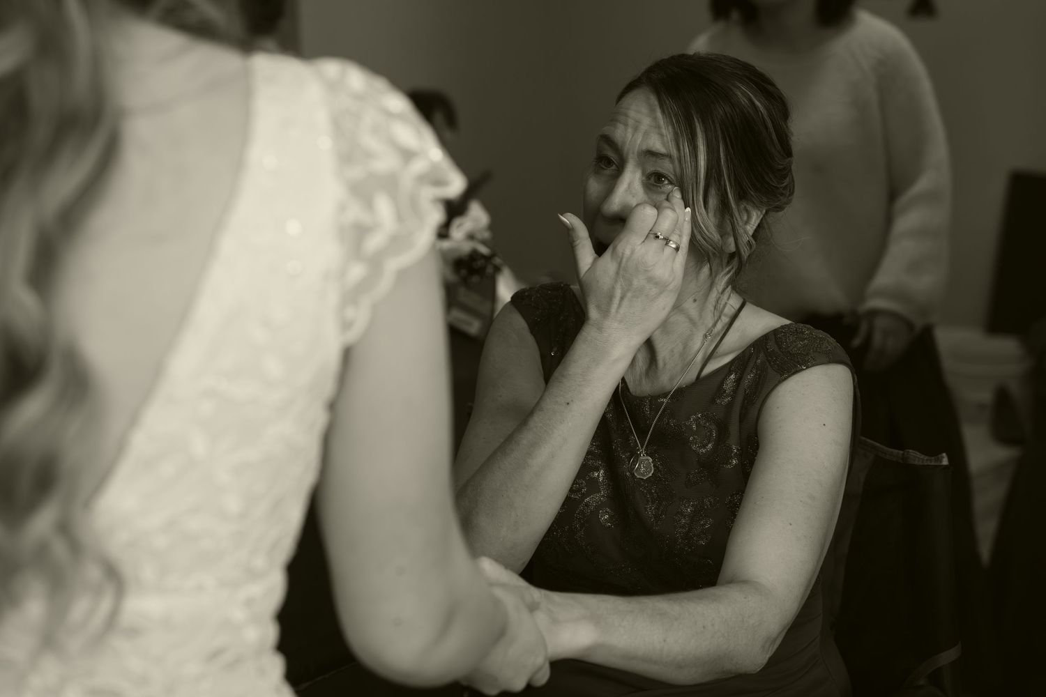 People dancing and embracing on a dance floor at a party or celebration event.