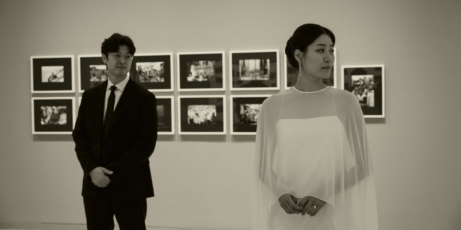 A series of black and white photographs displayed in a gallery showing various scenes and moments.