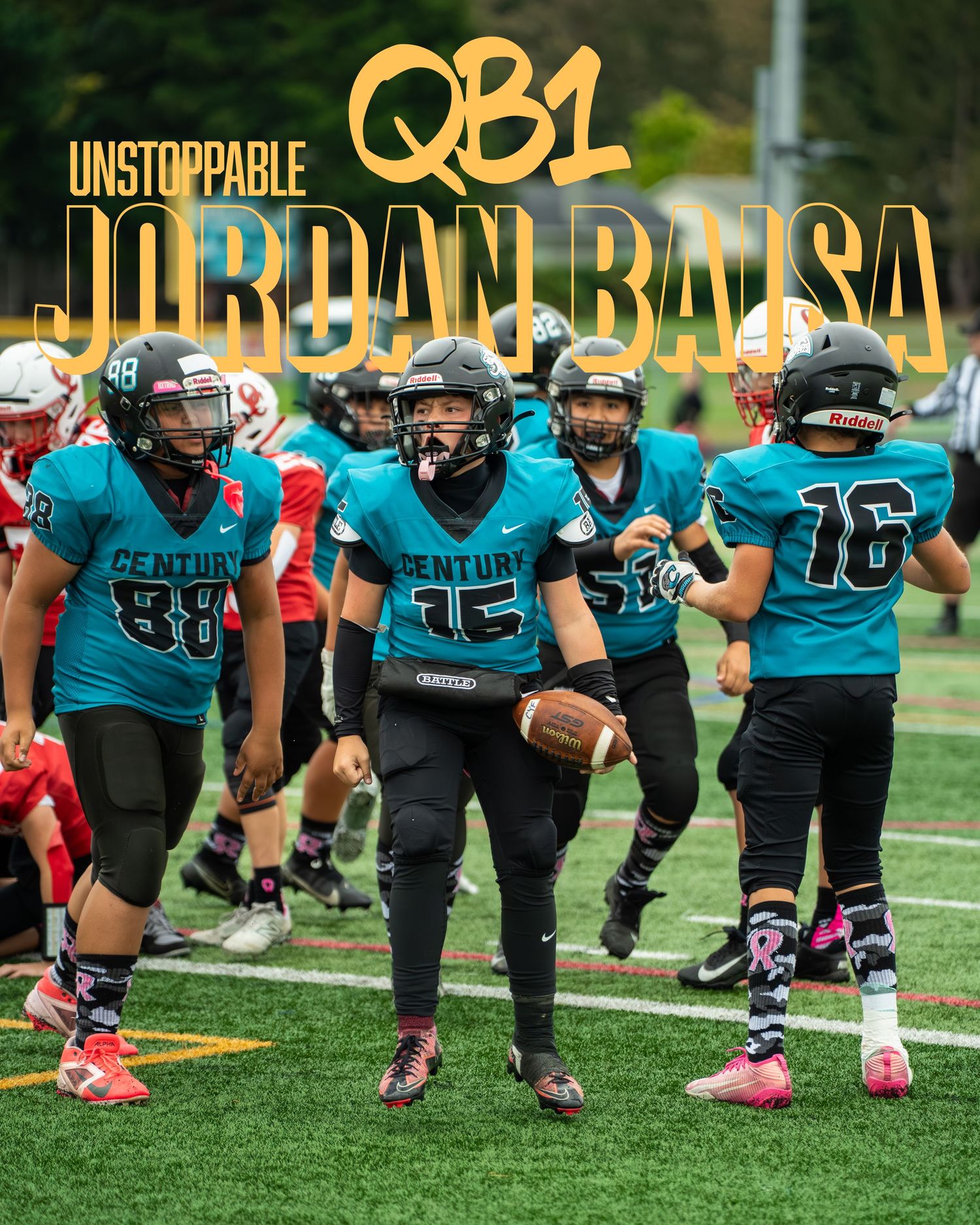 Football team in teal uniforms lined up on artificial turf field during game.