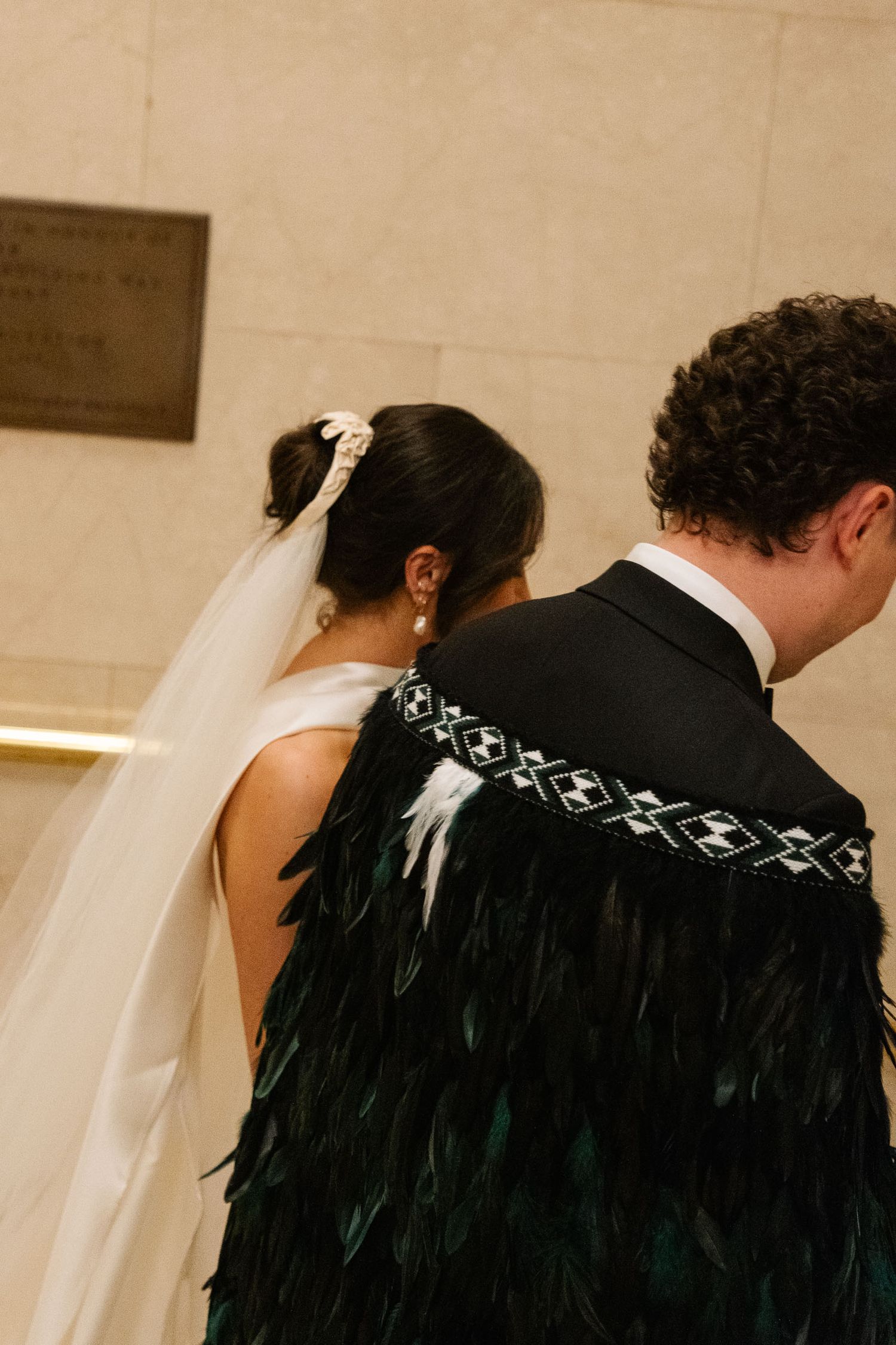 A series of sepia-toned wedding photos showing a couple in traditional ceremony attire from different angles.