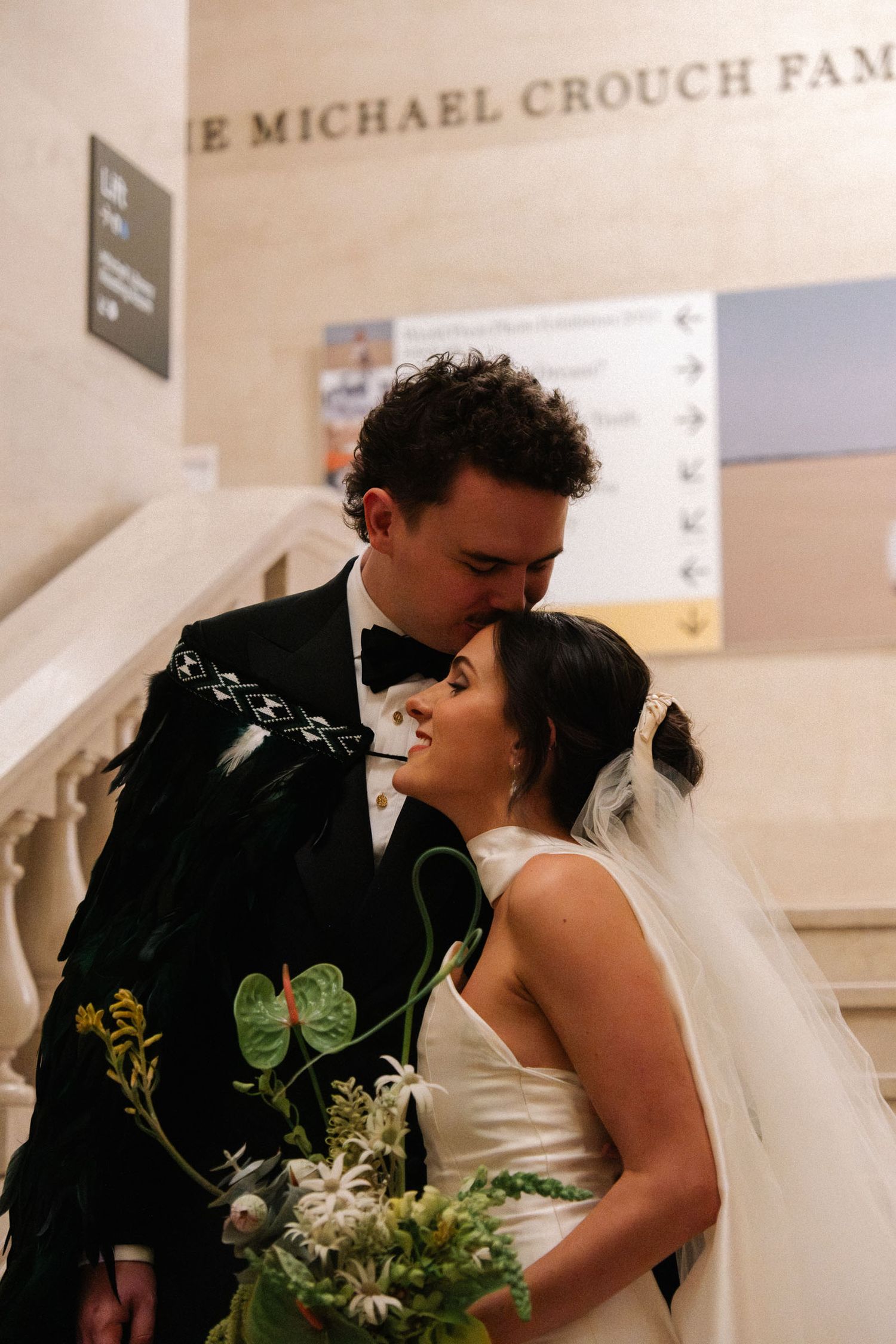 A romantic wedding moment captured in a sequence showing the couple sharing their first kiss at the altar.