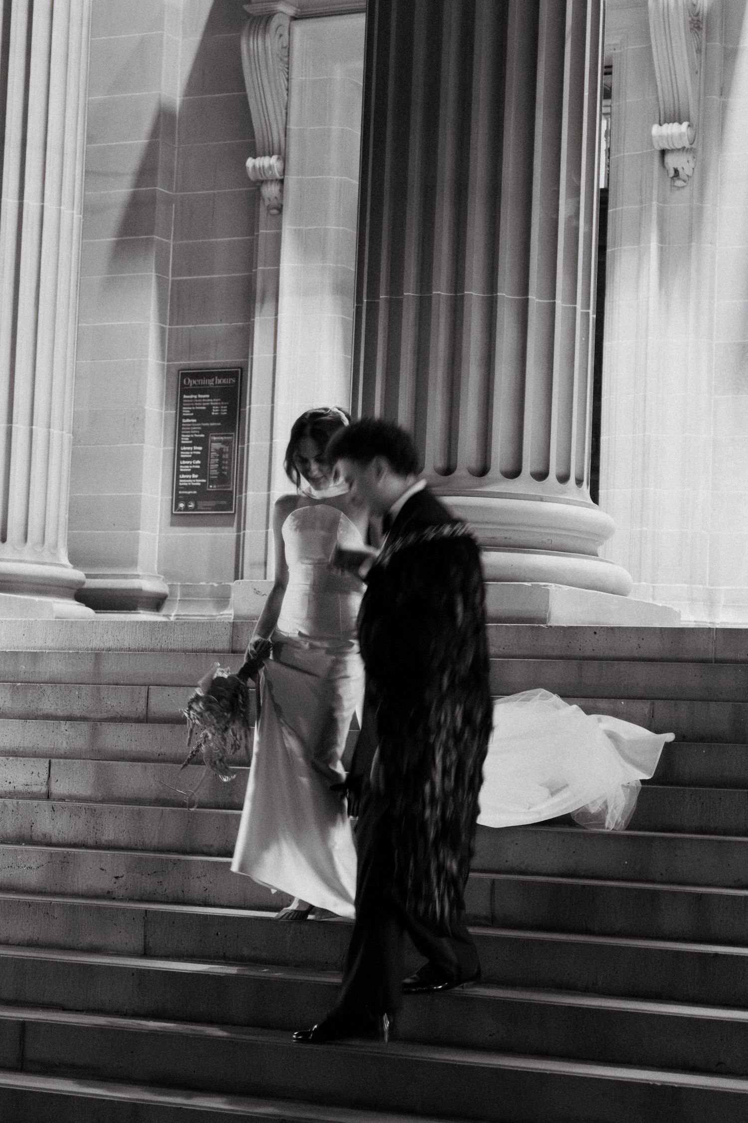 A black and white photo sequence shows two people sitting on steps outside a building with classical columns.