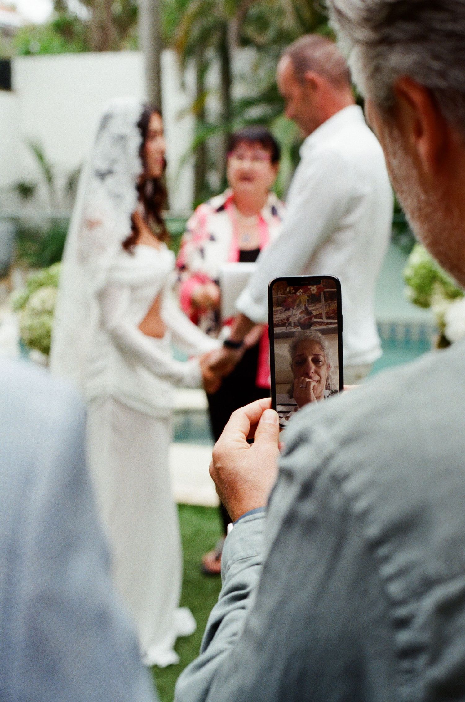 A sequence of photos showing someone taking pictures with a smartphone at what appears to be a wedding event.