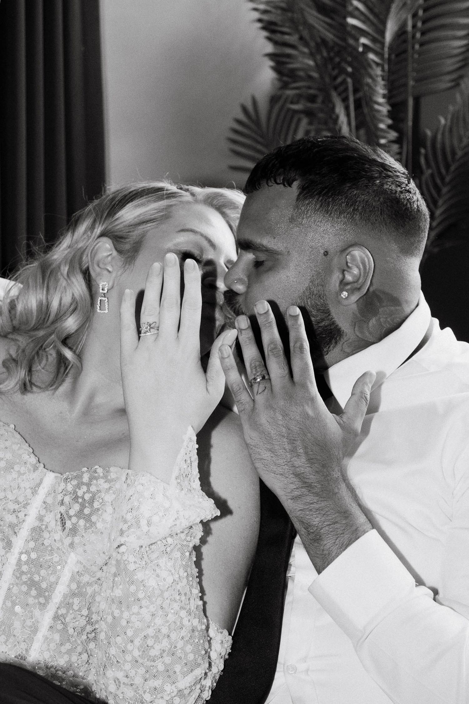 A romantic sequence of black and white wedding photos showing intimate kisses between a couple.