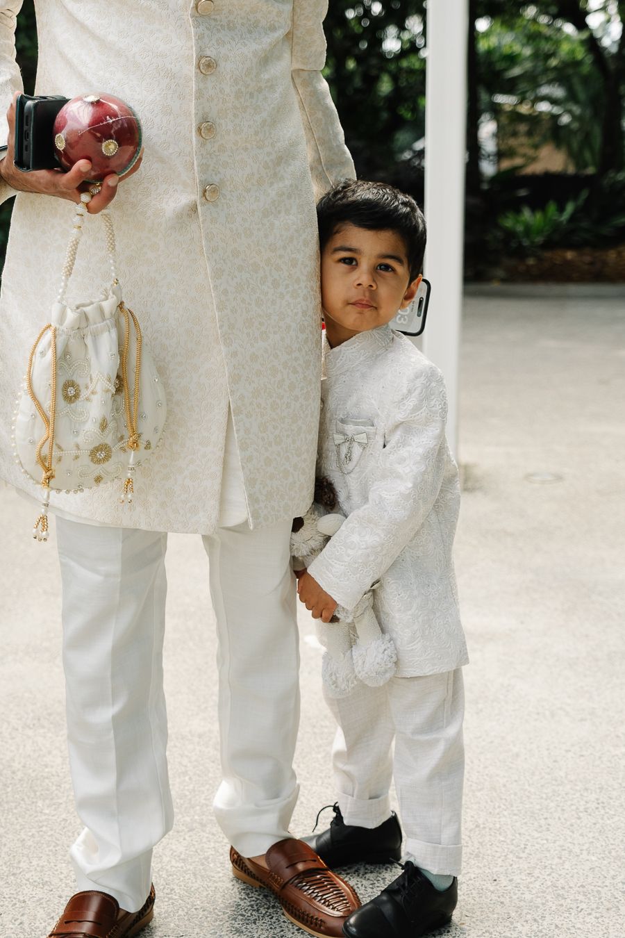 Four cropped views of white formal attire and brown leather shoes at a formal event.