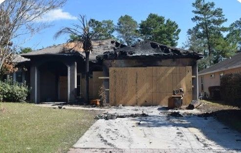 A picture of a house that has been on fire.