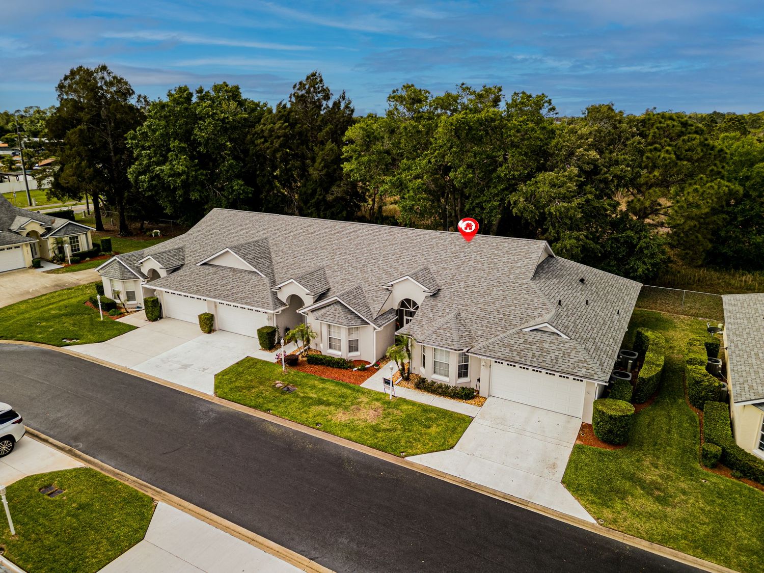 A drone photo of a house for sale.