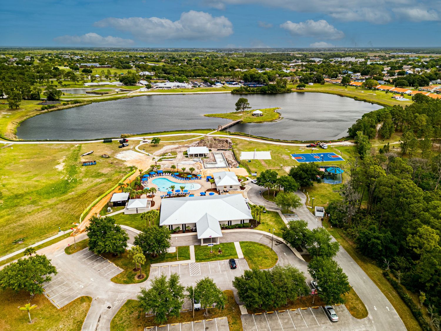 A drone photo of a house on the lake for sale.