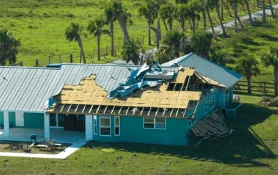 A drone photo of a damaged roof.