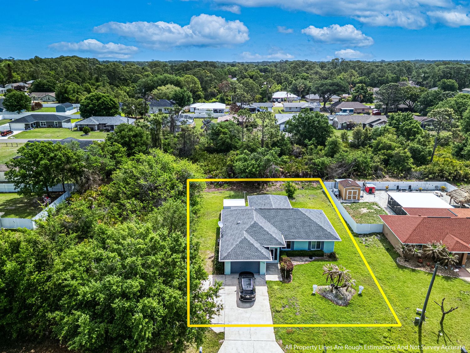 A drone photo of a house for sale.