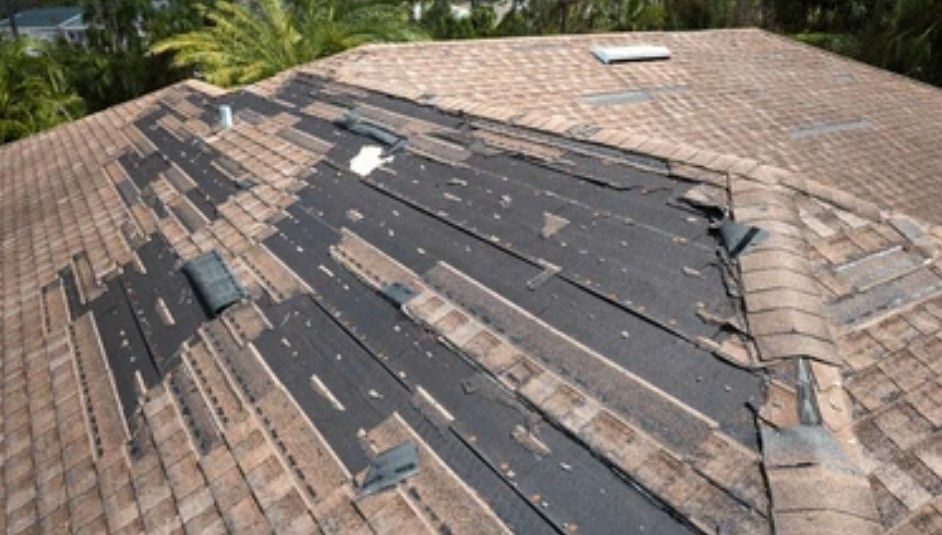 A drone photo of a damaged roof.