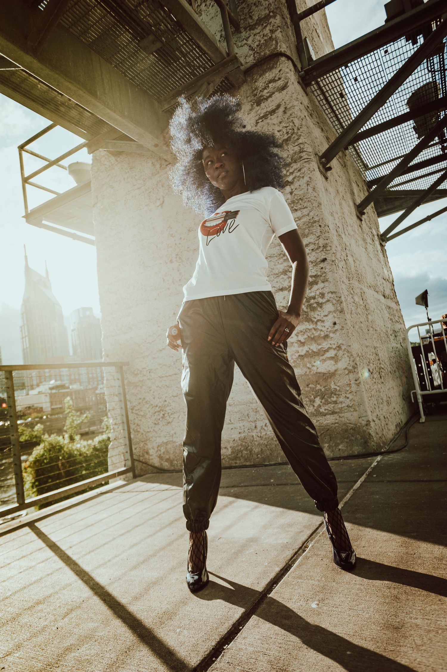 A sequence of dynamic skateboarding movements captured in sunlit industrial space with dramatic shadows.