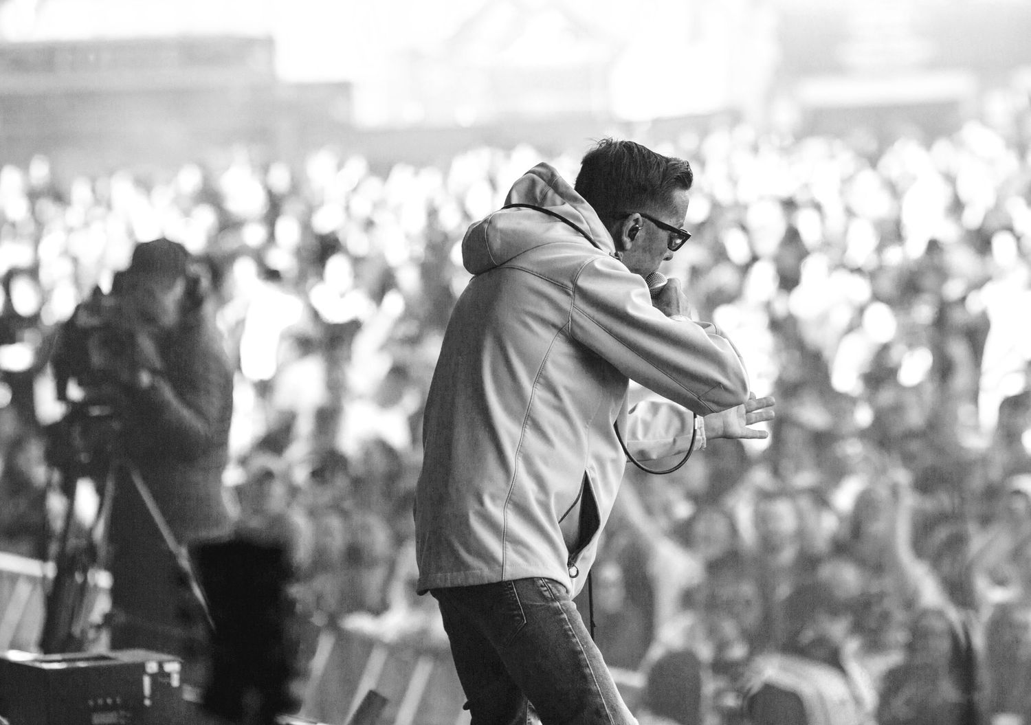 Image of Christy Dignam on stage at Malahide castle supporting Gery Ciniman. Shot taken from the stage with the crowd in the background.