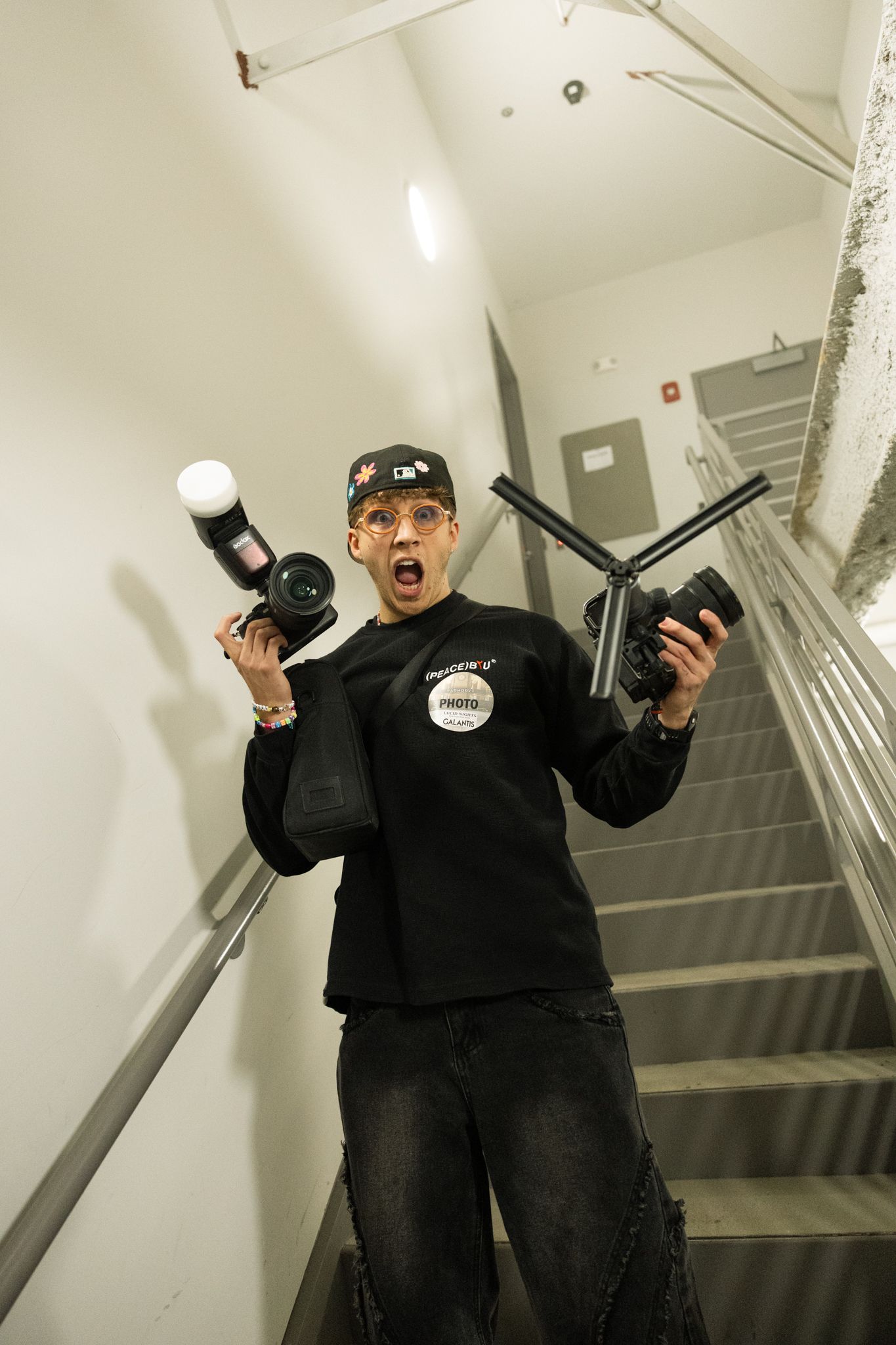 Luis Borja with two cameras. One for video and one for images at the Armory in Minnesota for Eddie Adams New Years 2025(6)