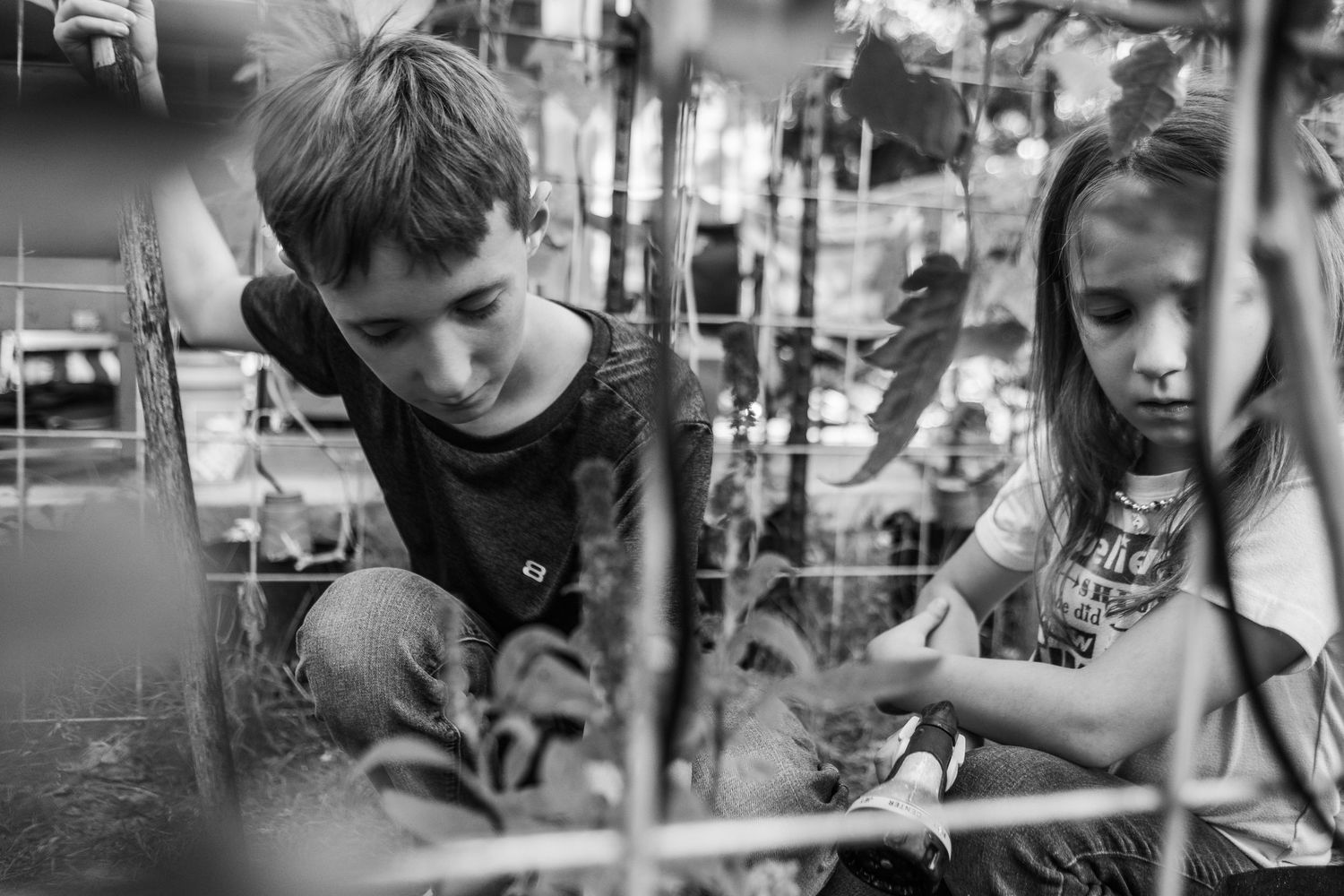 black and white images of children working in a garden