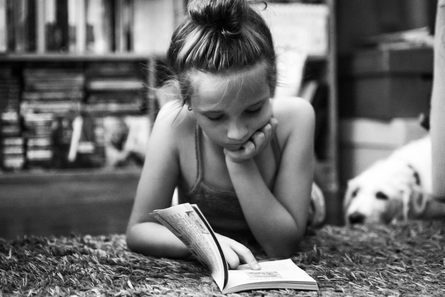 black and white images of a girl reading a book