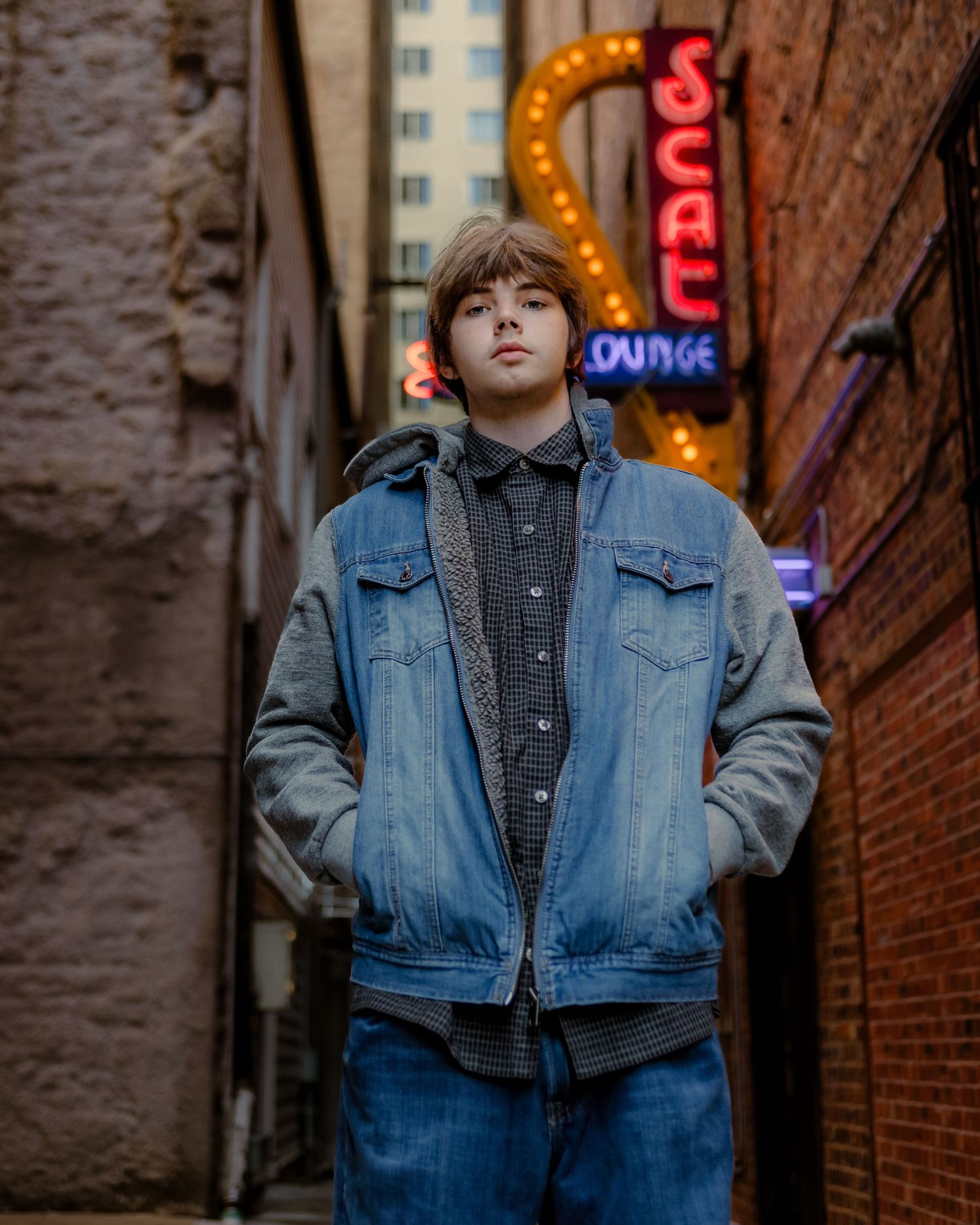 Senior boy posing in alley in Downtown Fort Worth