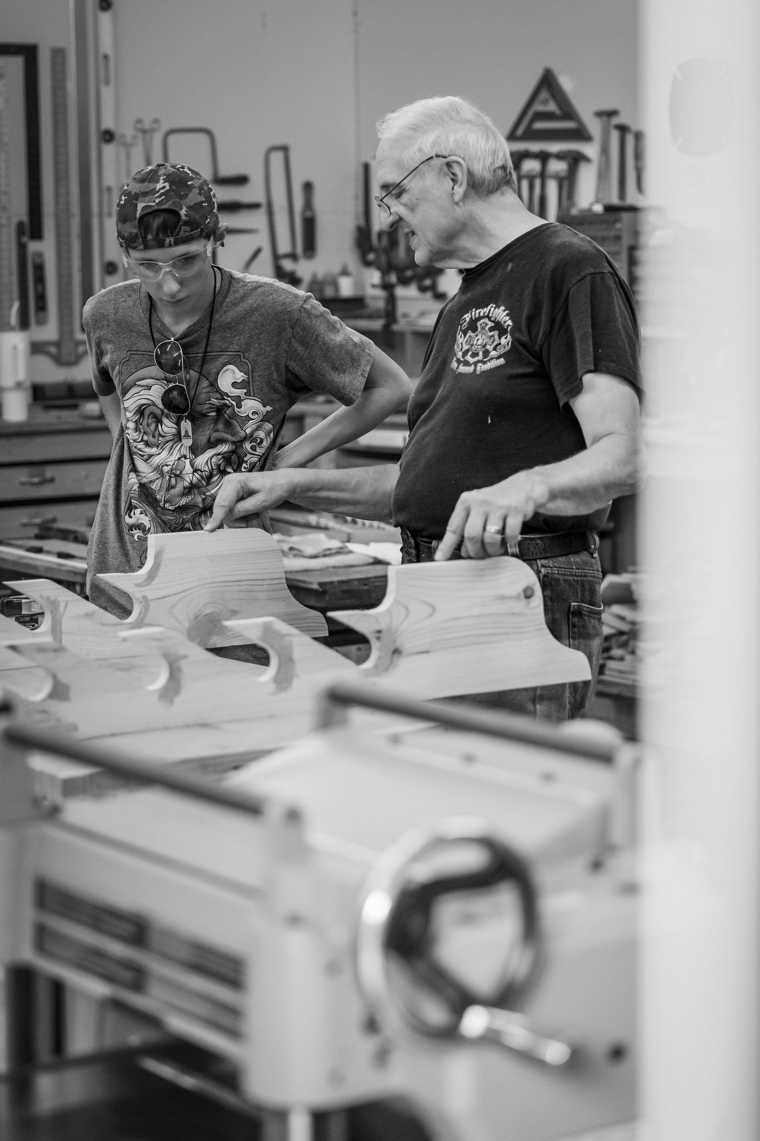 Multiple black and white images show woodworking students concentrated at tables in a workshop setting.