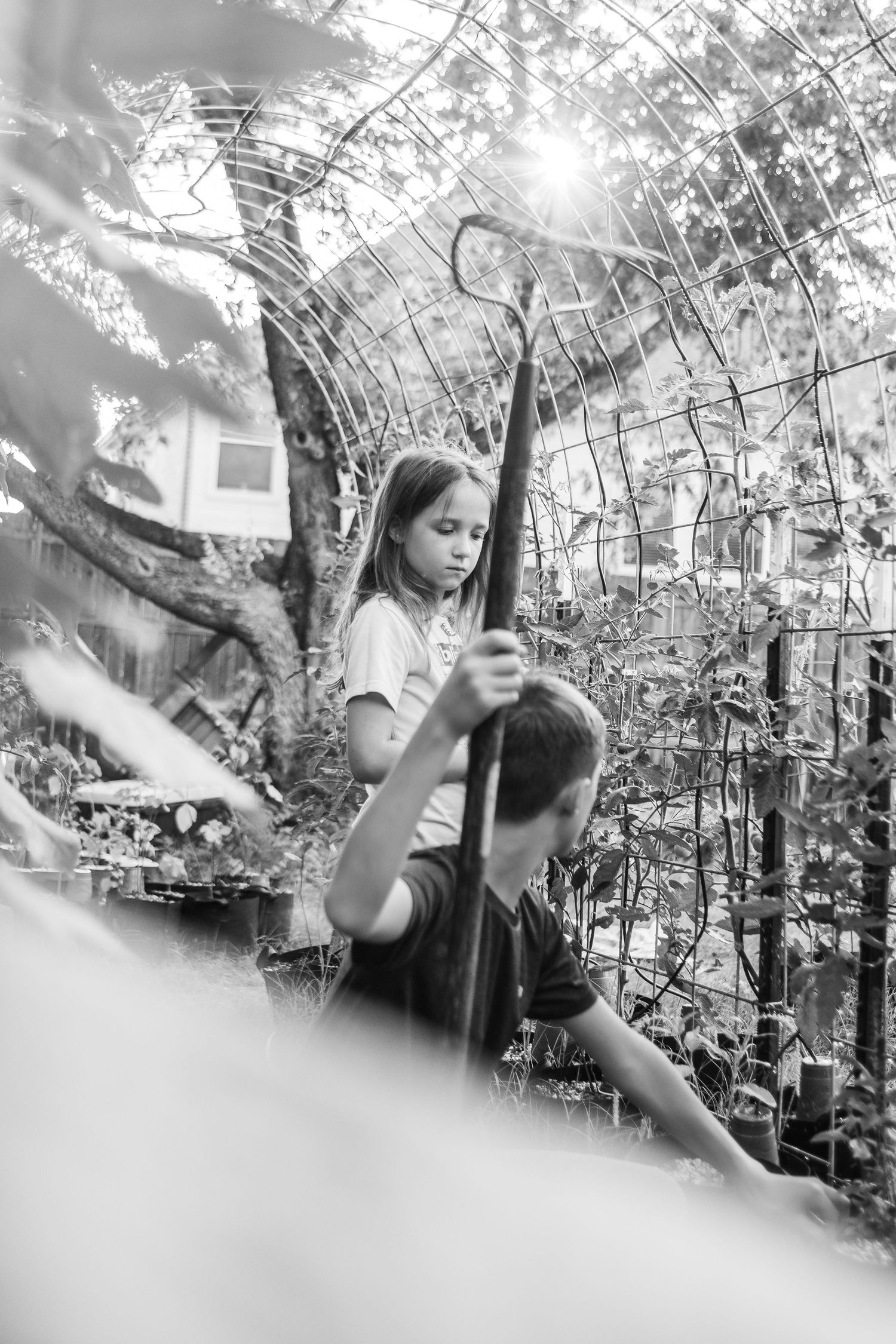 black and white images of children working in a garden