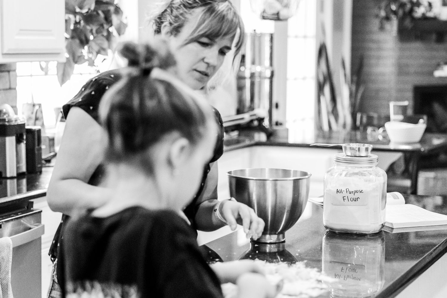 black and white images of mother and daughter making homemade pasta