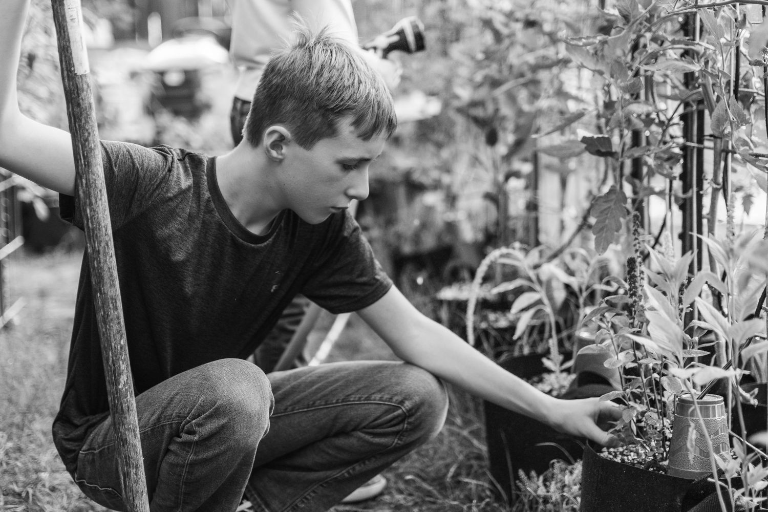 black and white images of children working in a garden