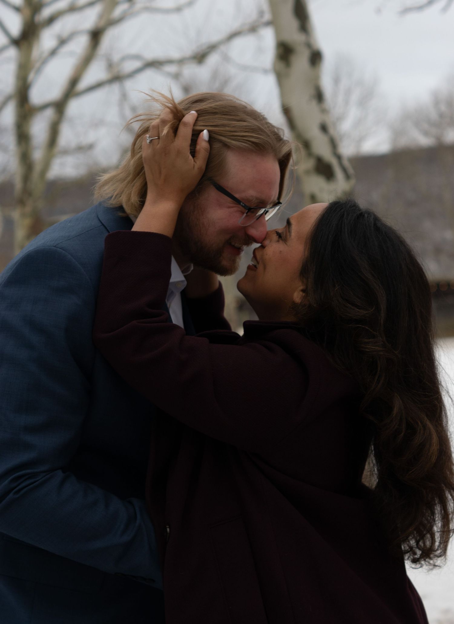 Couple dancing at the Gaffer District in Corning, NY during a winter wedding engagement photography session