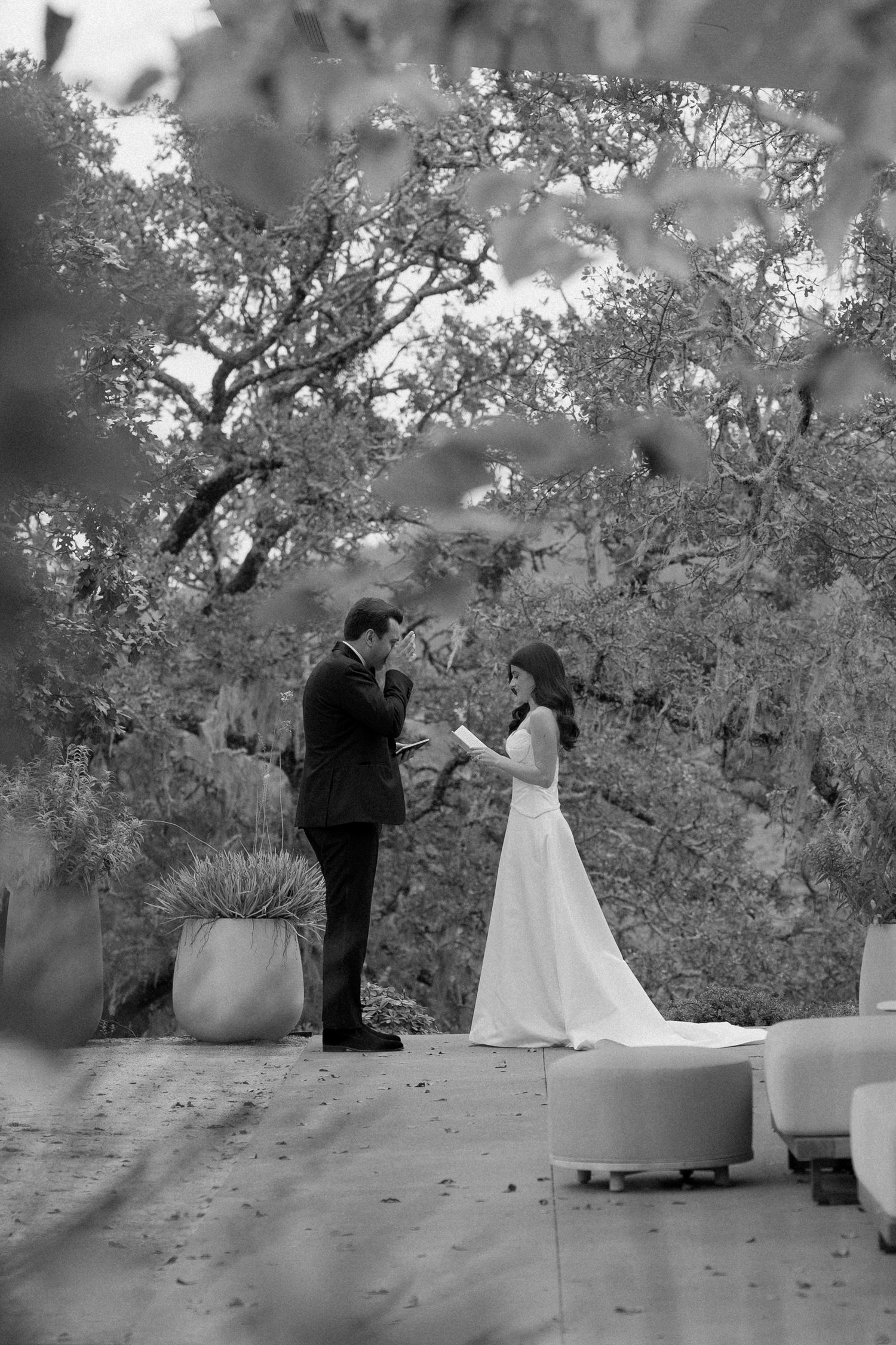 Black and white wedding ceremony sequence in an outdoor garden setting.